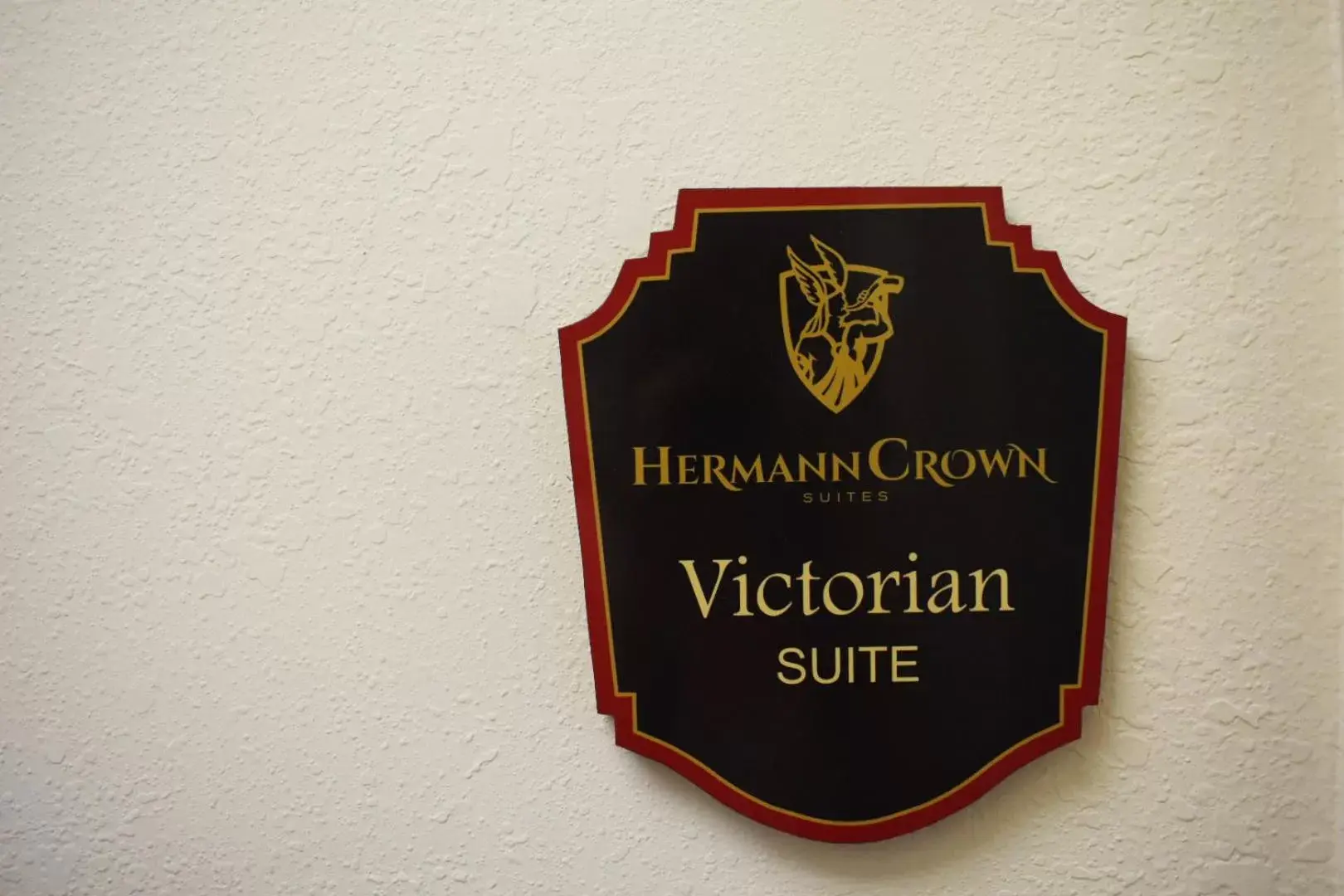 Property logo or sign in Hermann Crown Suites