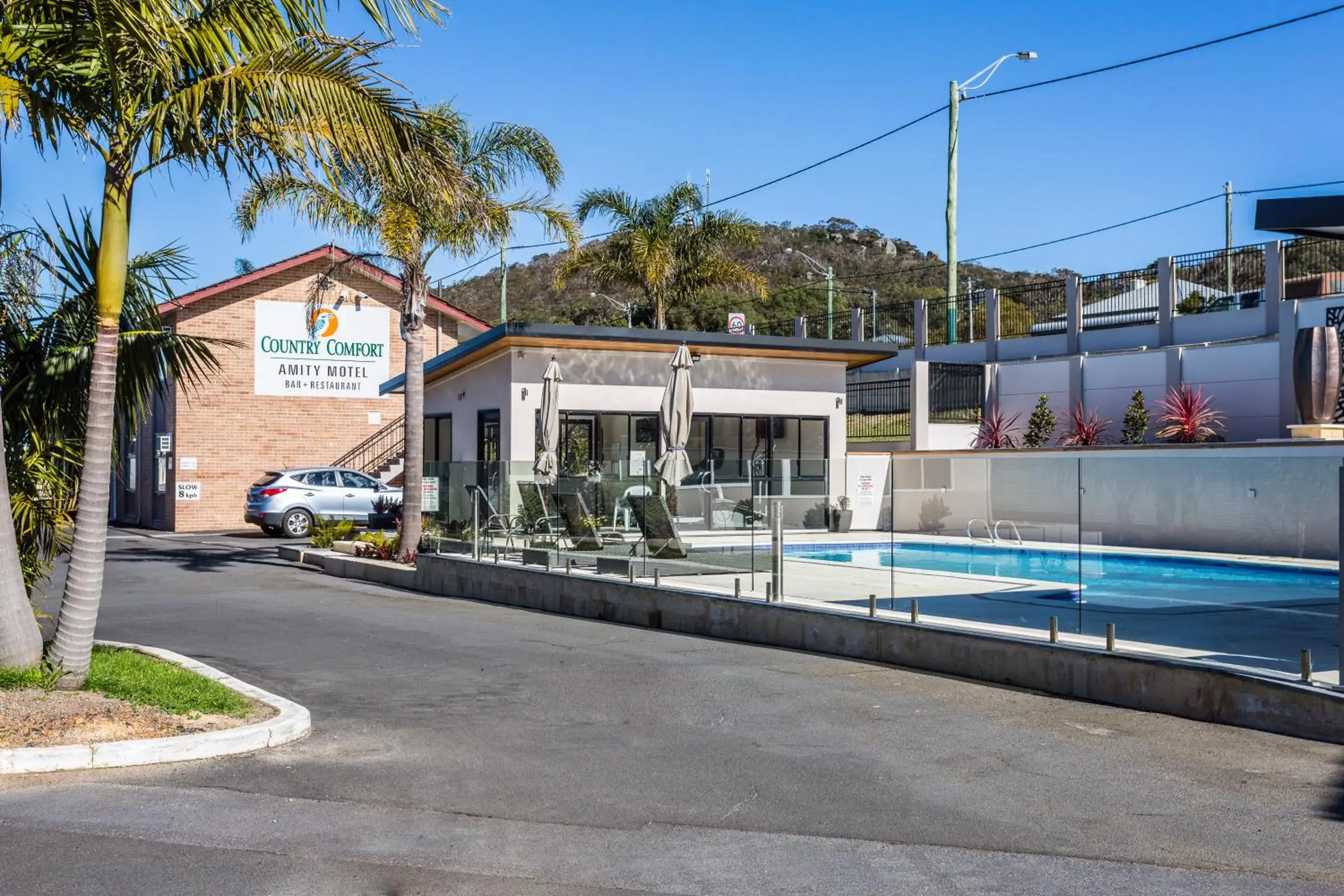 Swimming pool, Property Building in Country Comfort Amity Motel