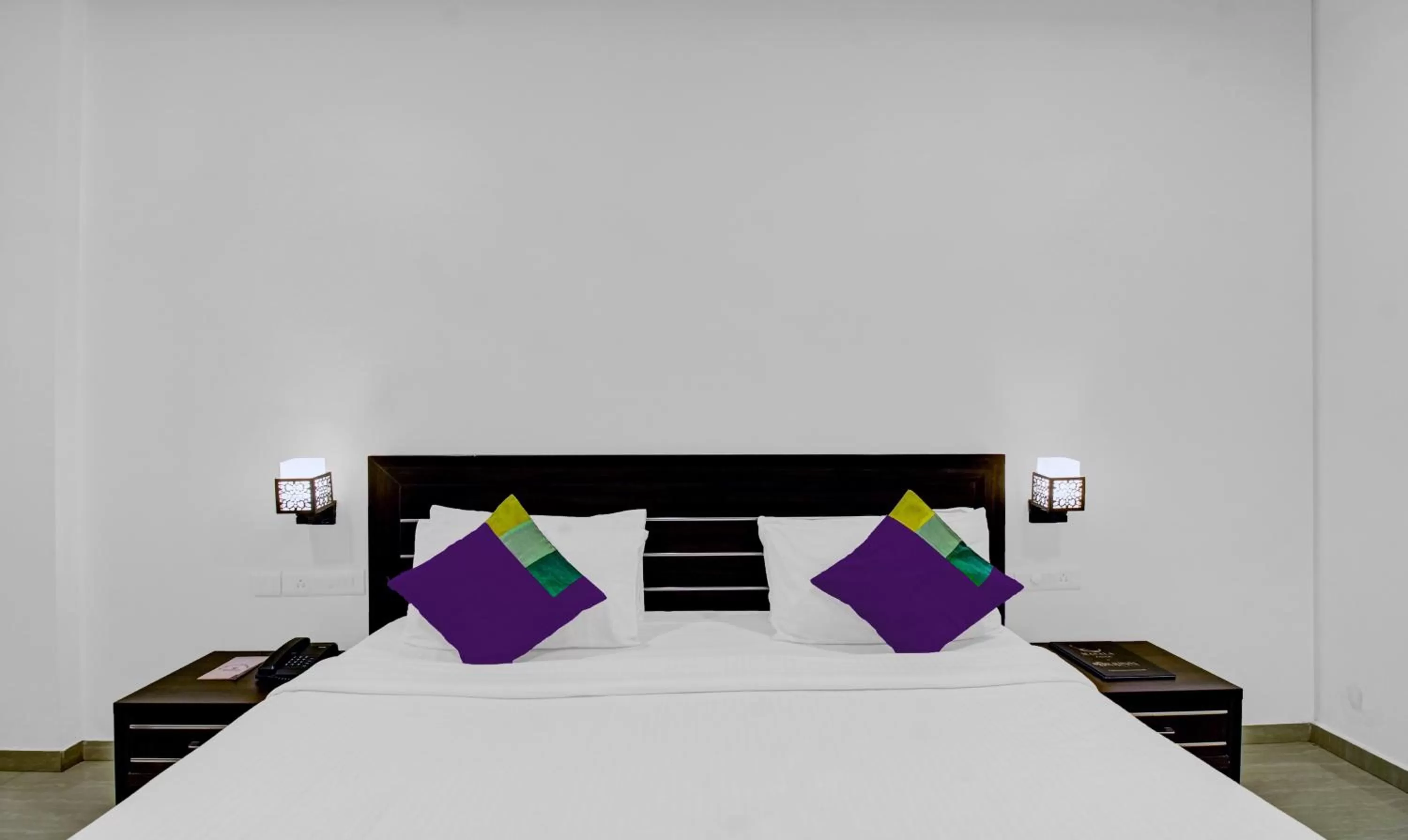 Bedroom, Bed in Treebo Premium Brijinn