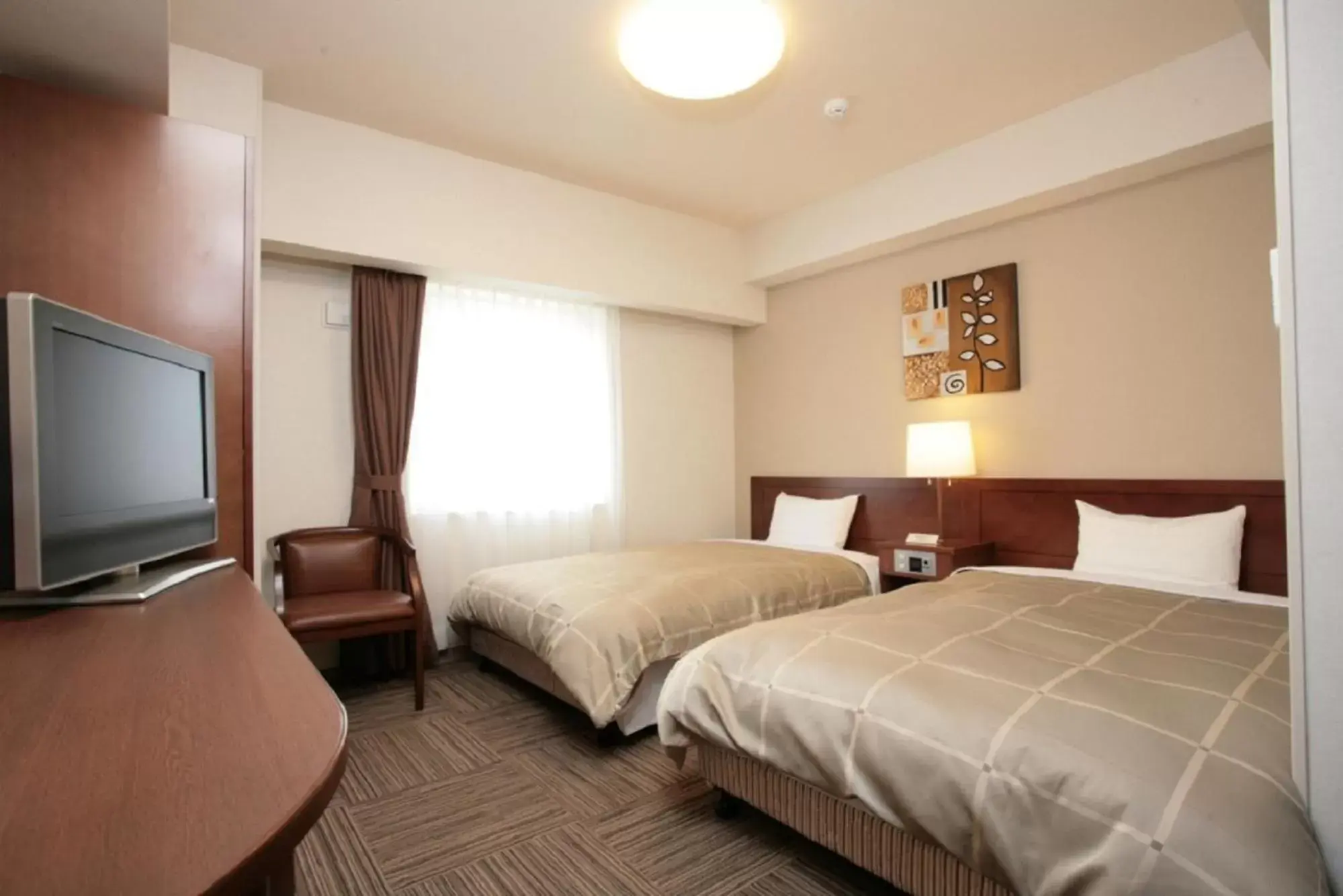Bed in Hotel Route-Inn Iwaki Ekimae