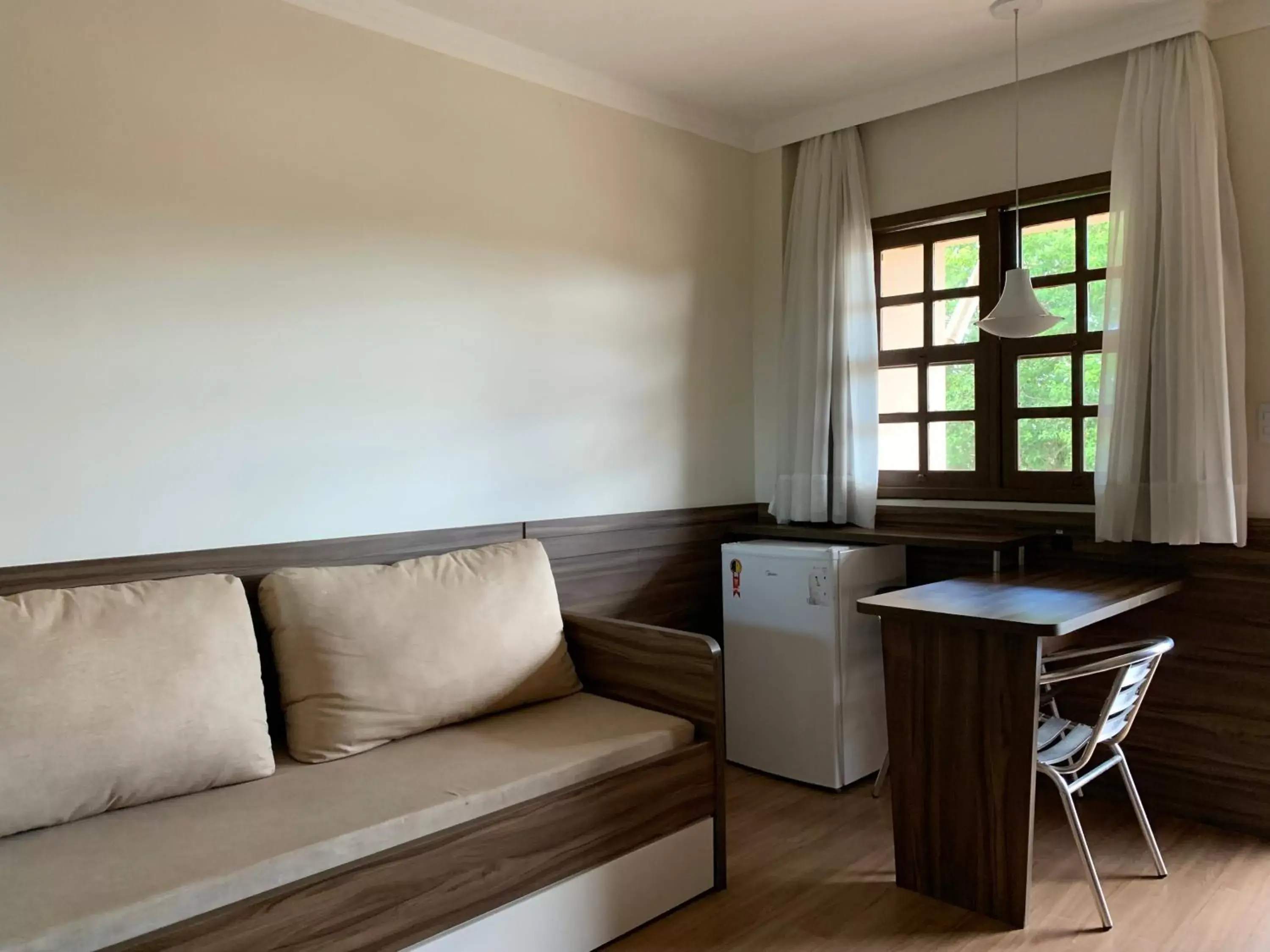 Bed, Seating Area in Hotel São Sebastião da Praia