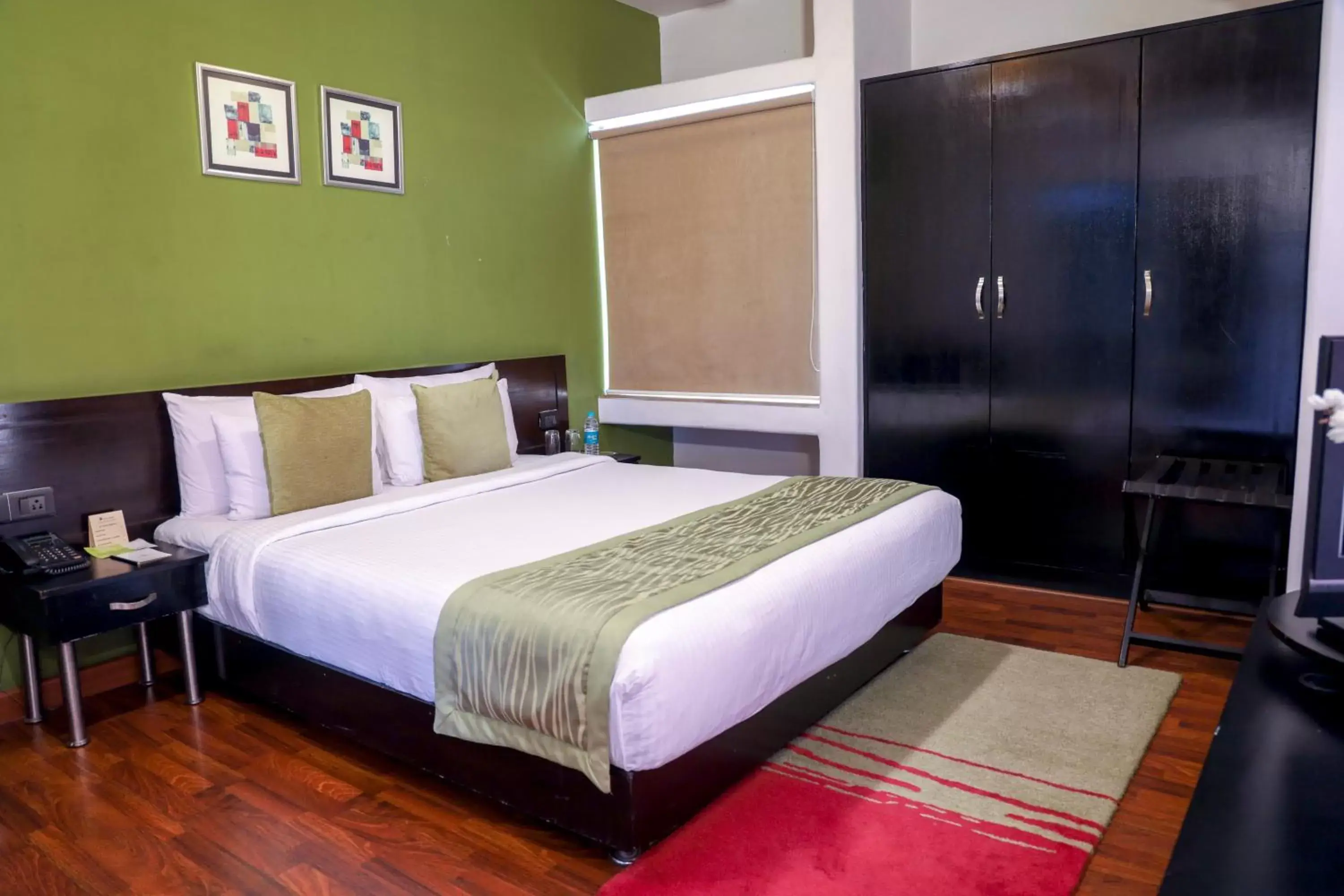Bed in Royal Orchid Golden Suites Pune