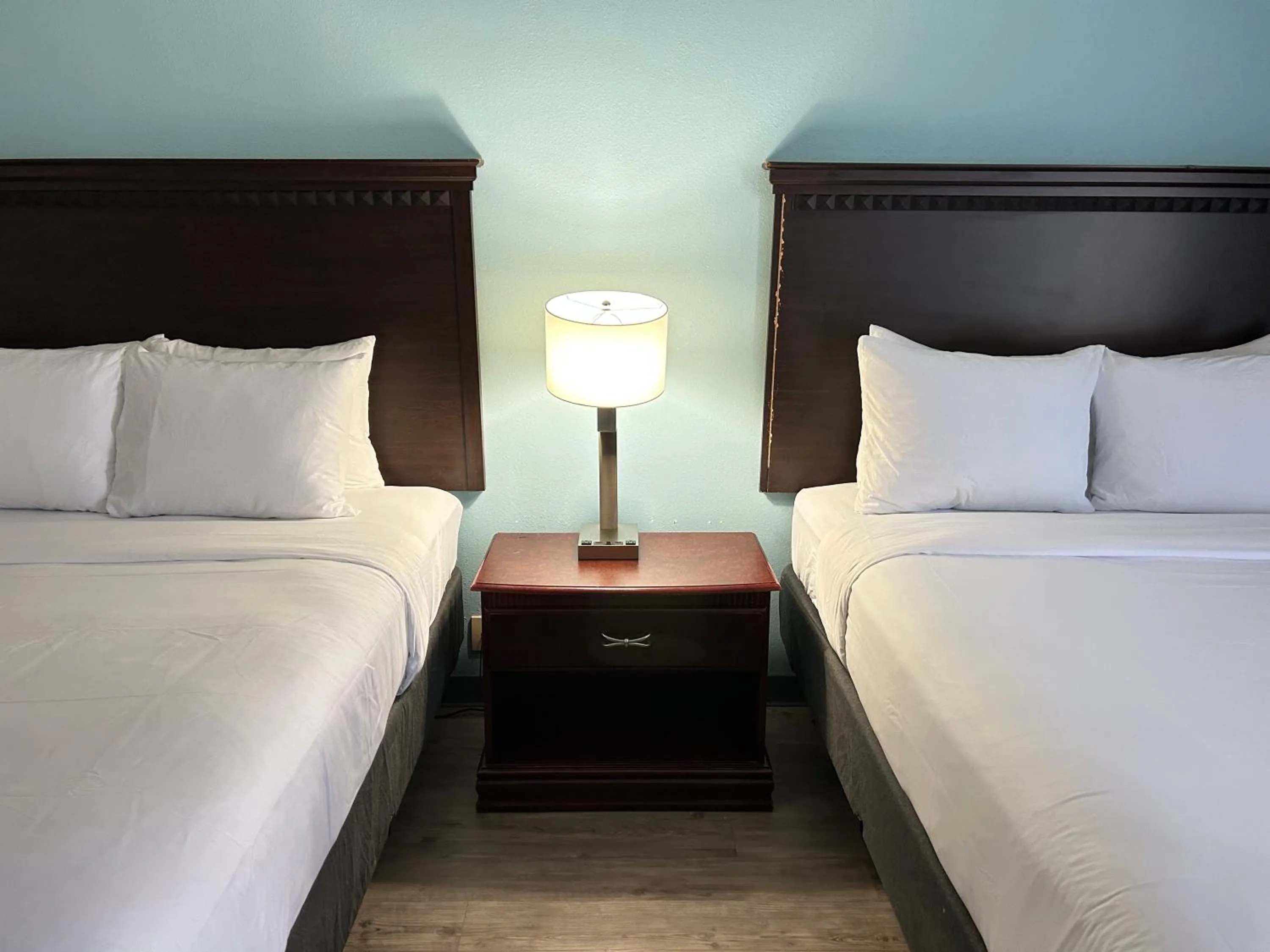 Bed in Clarion Inn & Suites Grand Rapids Airport