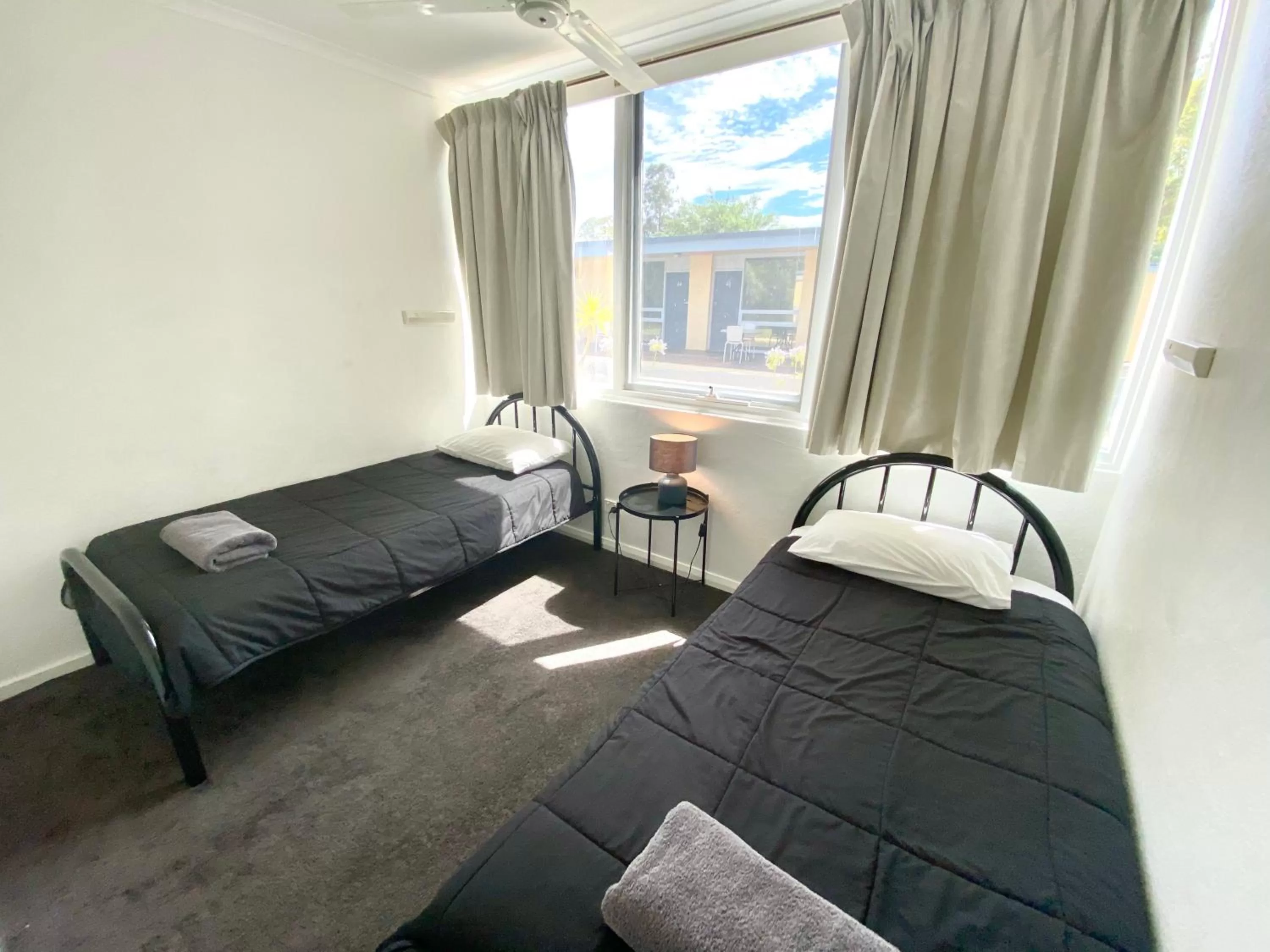 Bed in William Macintosh Motor Lodge