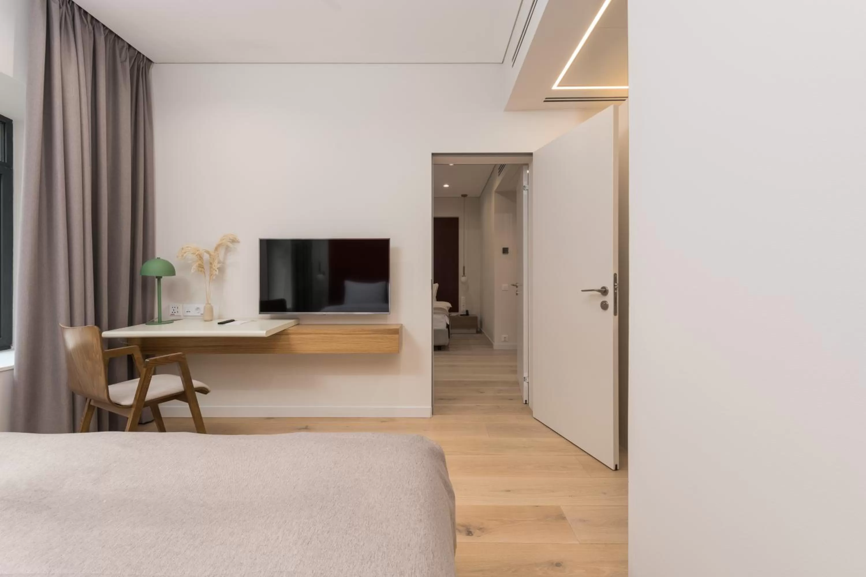 Bed, TV/Entertainment Center in Sophia Hotel Kyiv