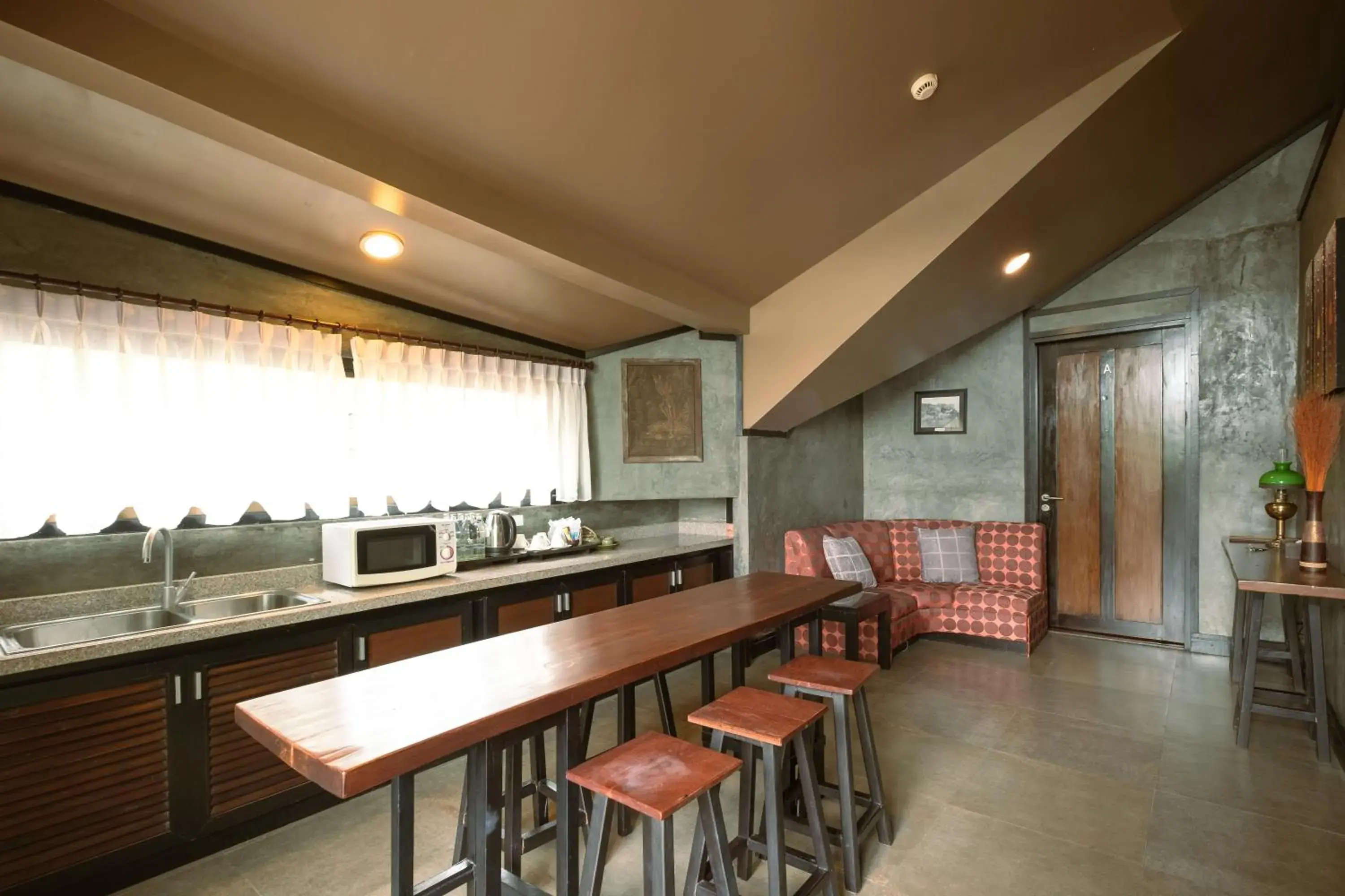 Dining area, Kitchen/Kitchenette in Kireethara Boutique Resort