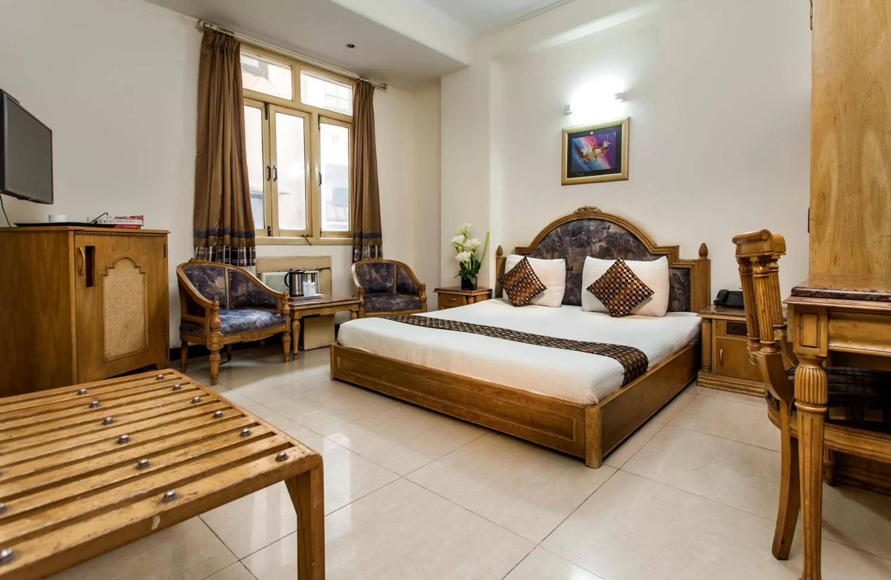 Bedroom in Hotel Sunstar Residency