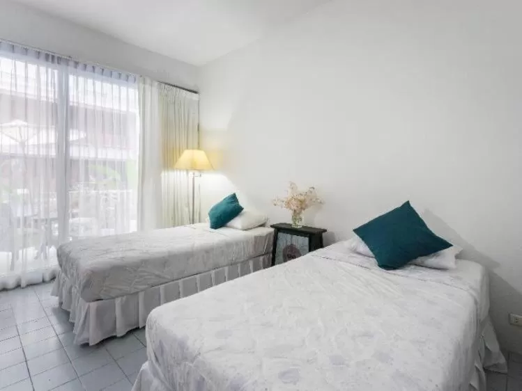 Bed in Oriental Smile Hotel