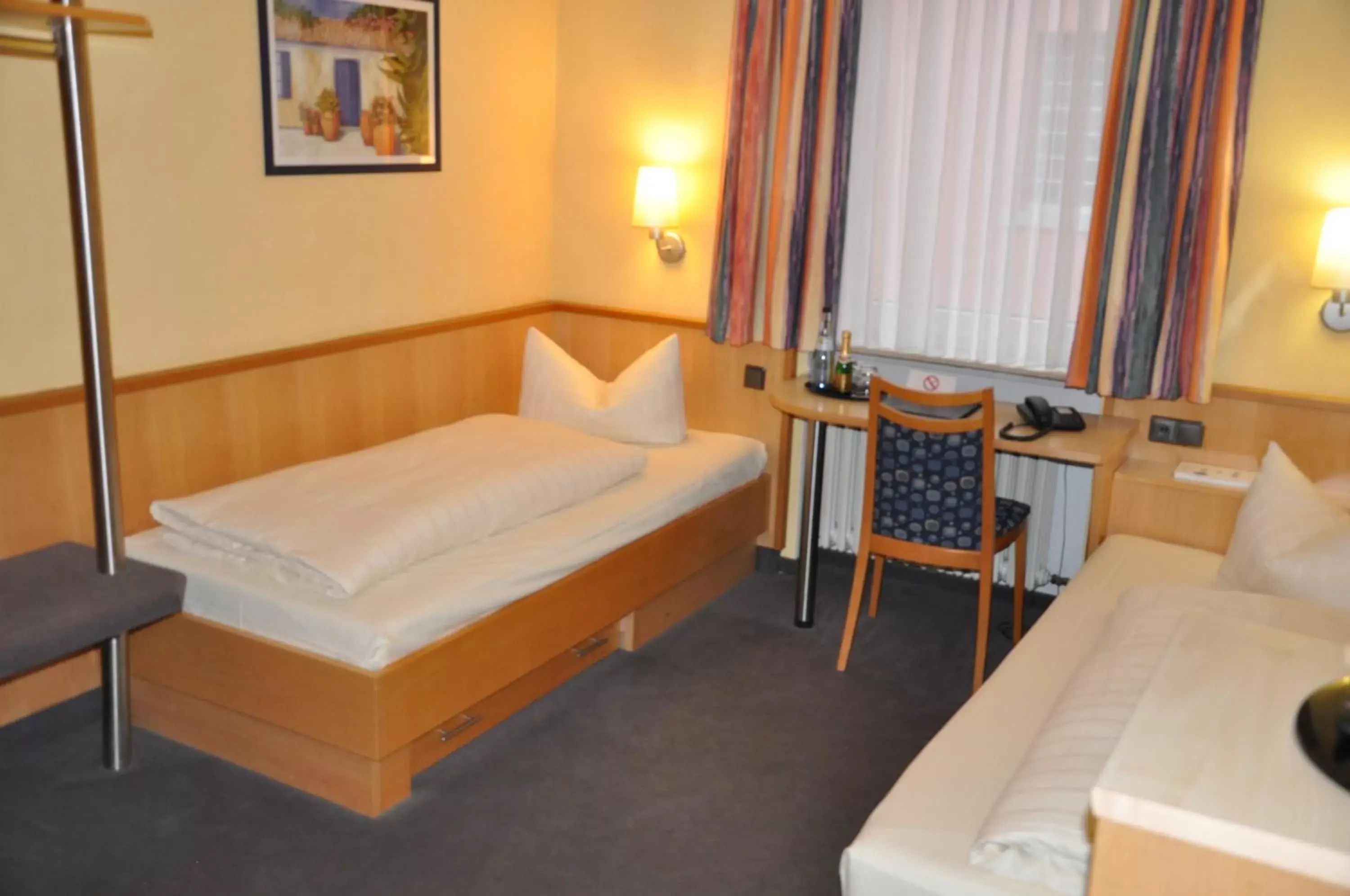 Bed in City Partner Hotel Strauss