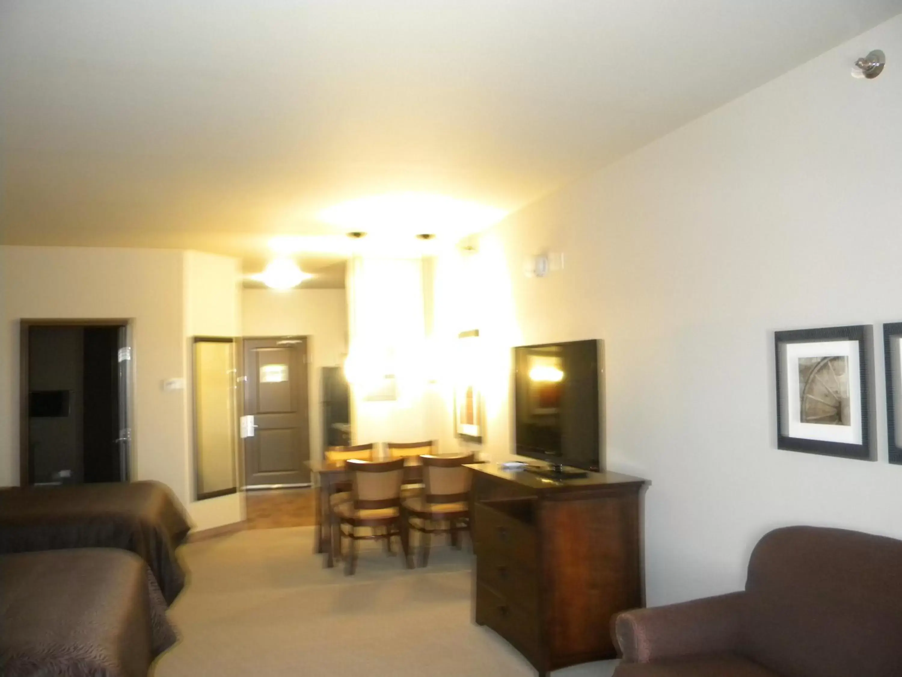 Bed, Seating Area in Teddy's Residential Suites Watford City