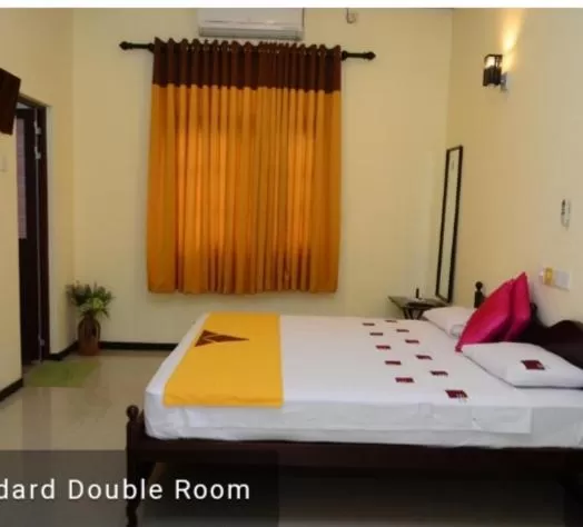 Bed in Jayasinghe Holiday Resort