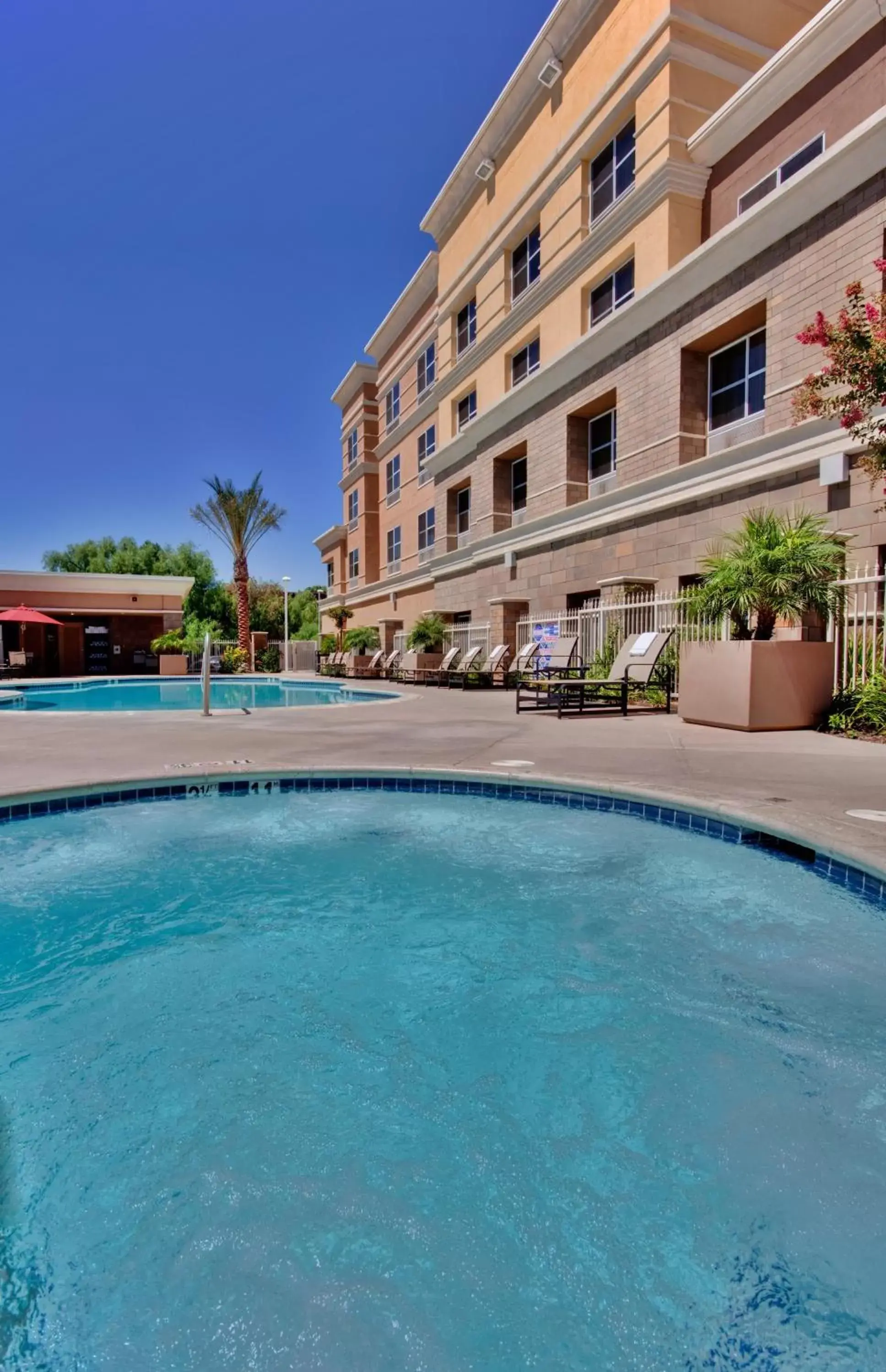 Swimming pool, Property Building in Holiday Inn Ontario Airport - California, an IHG Hotel