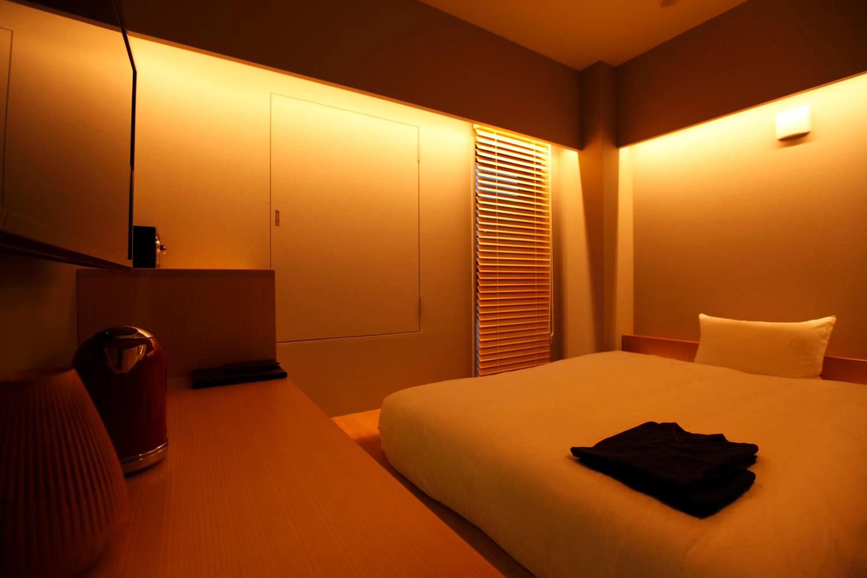 Bed in HOTEL AMANEK Ginza East
