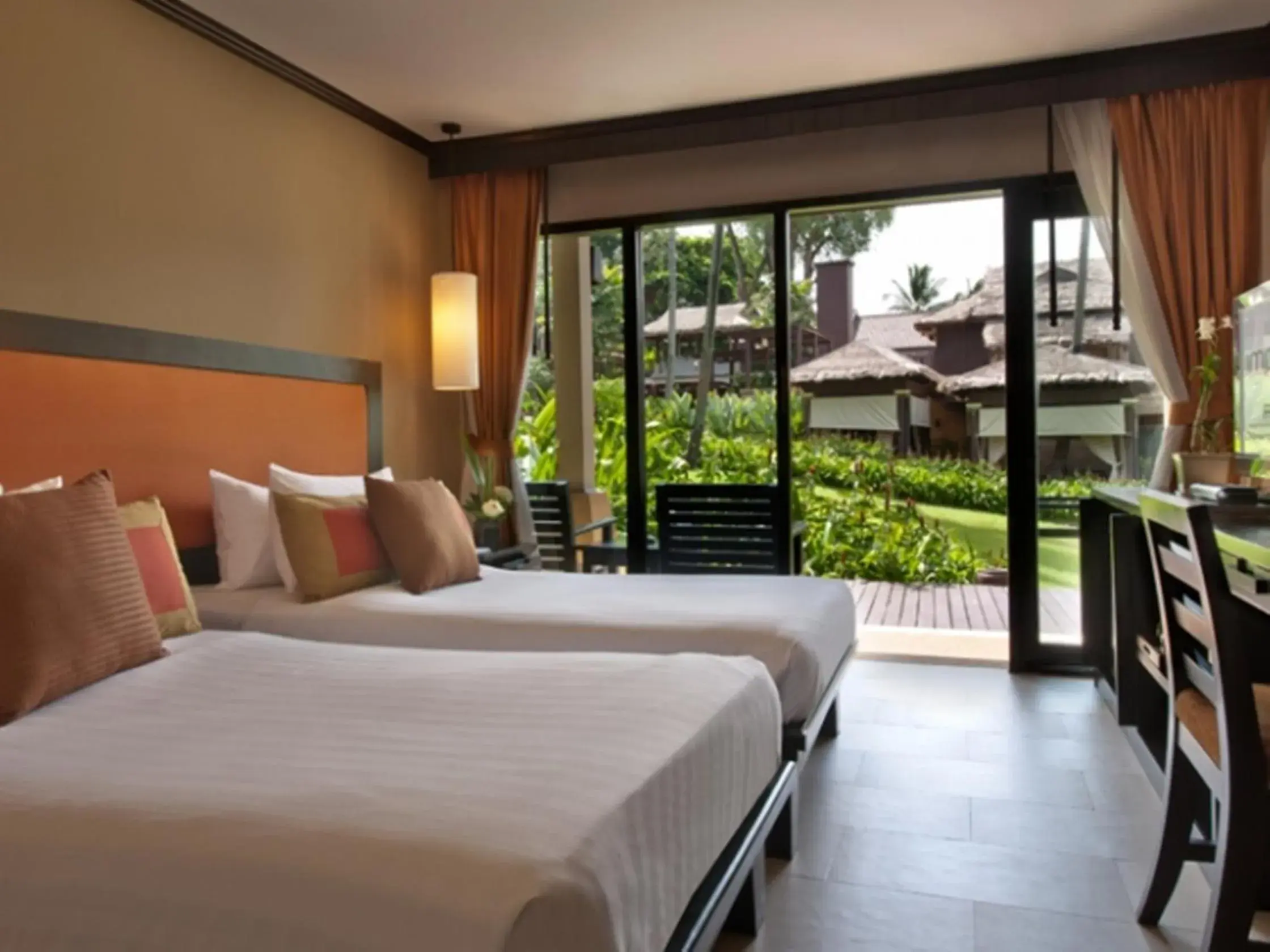 Bed in Impiana Beach Front Resort Chaweng Noi, Koh Samui