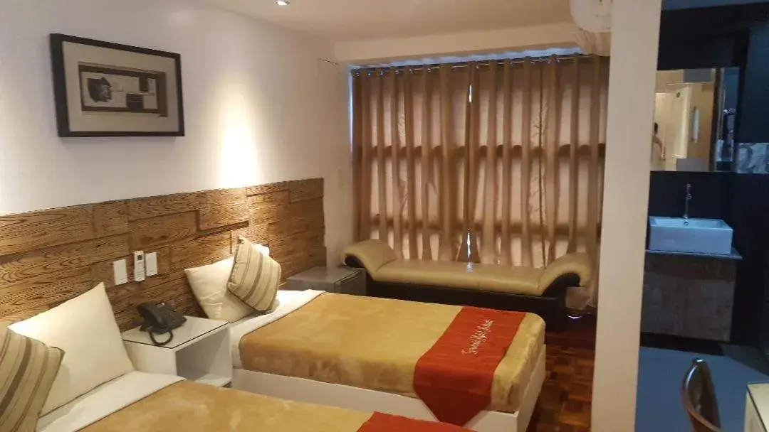 Bed in Gervasia Hotel Makati