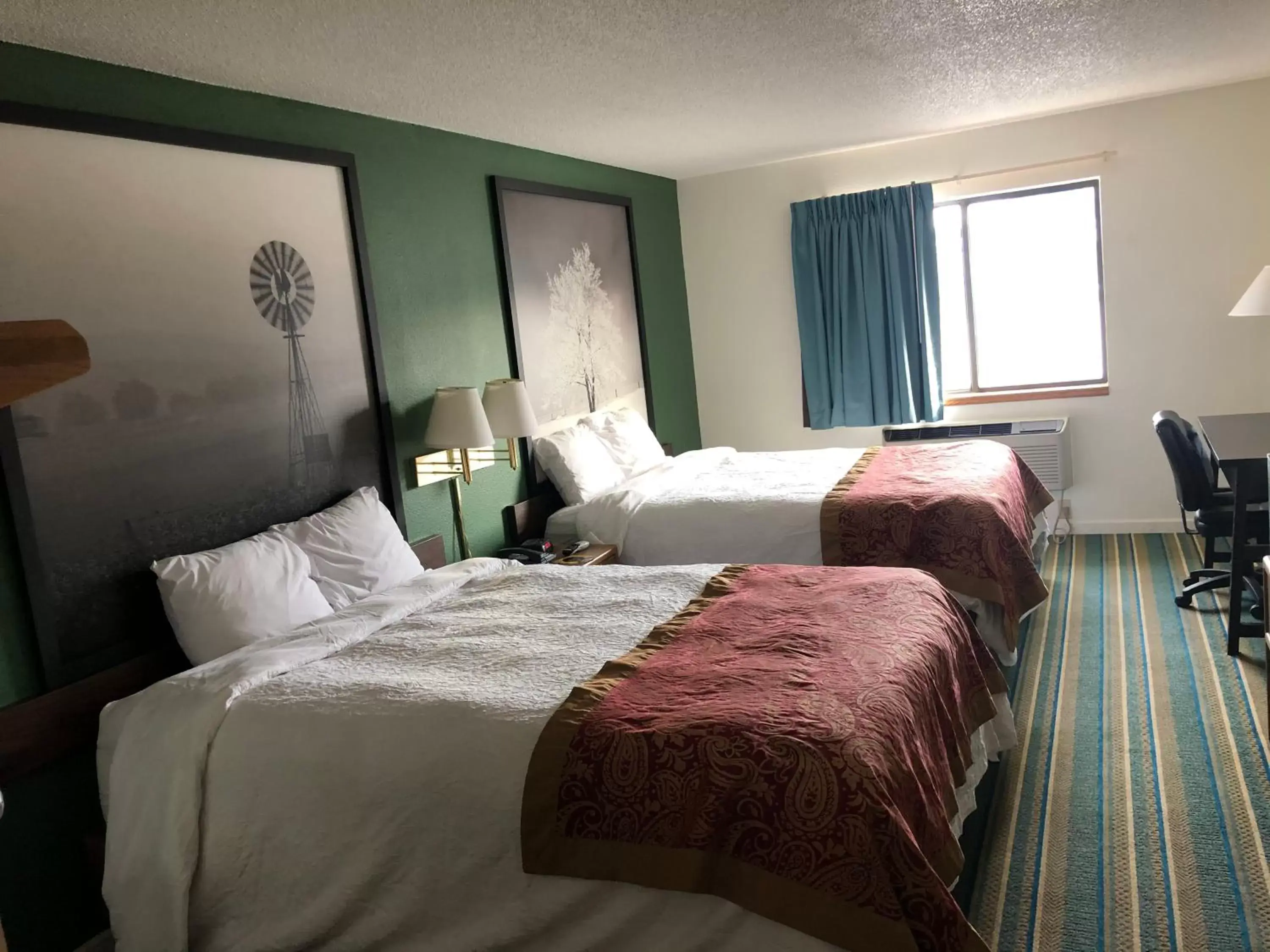 Bed in West Point Inn & Suites