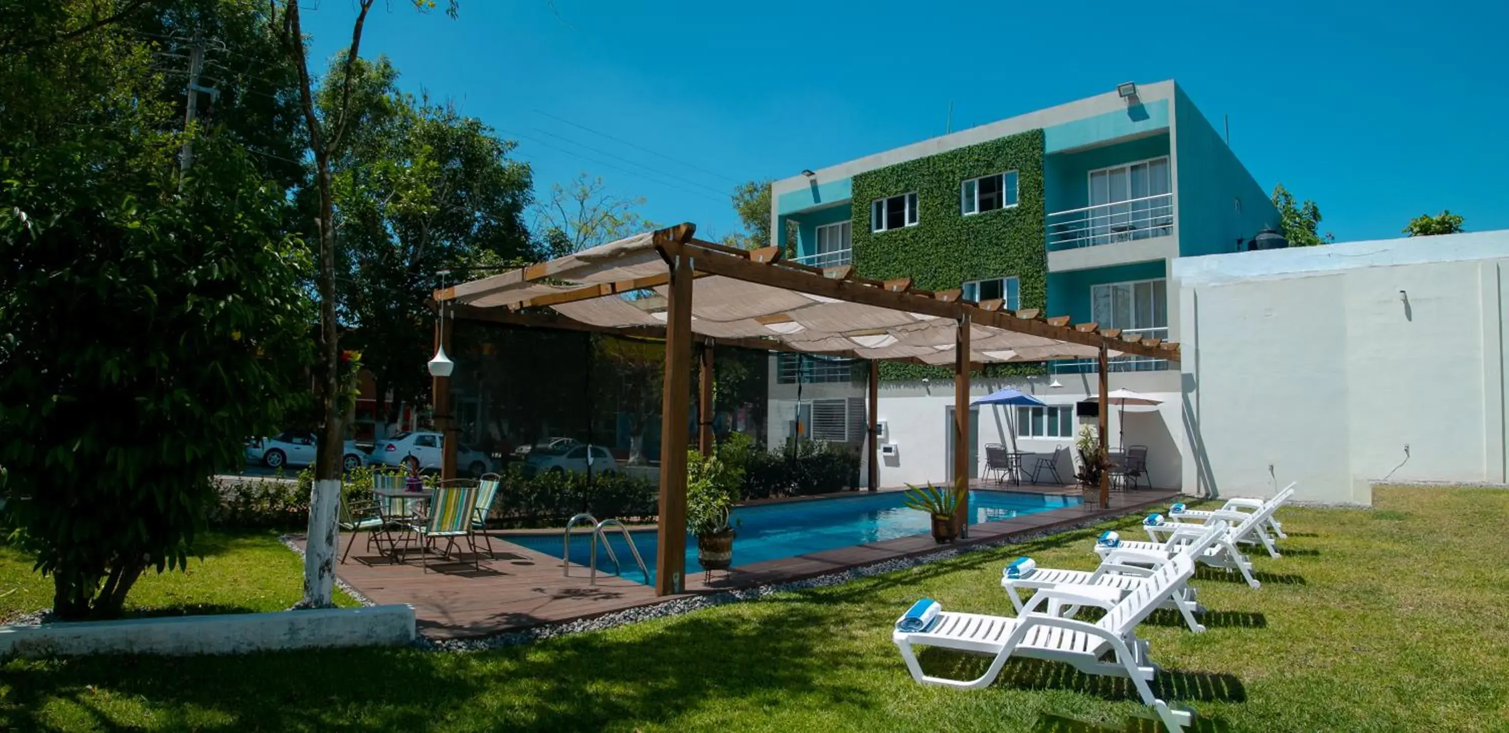 Patio, Swimming Pool in Relax Inn Suites