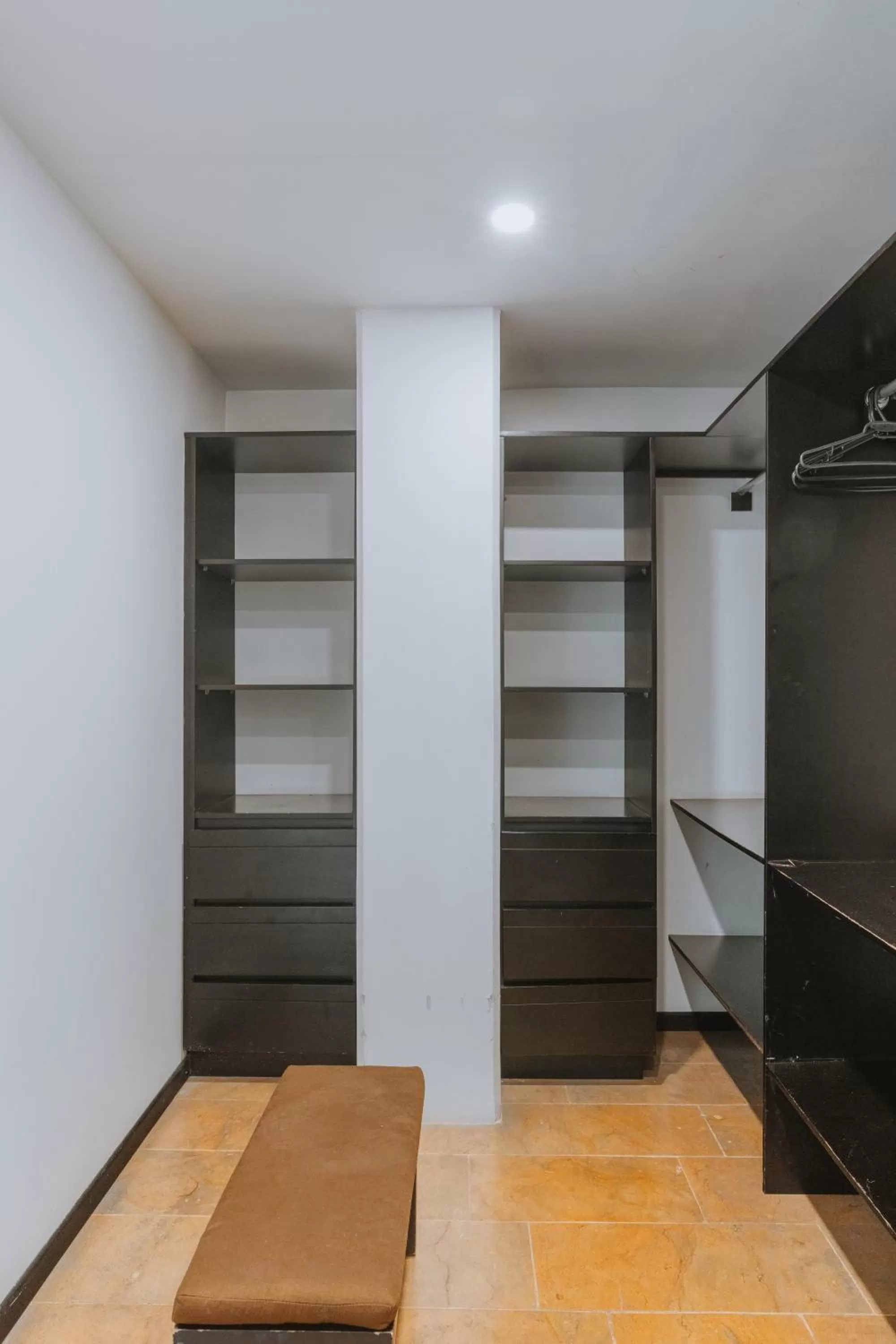 wardrobe, Bed in Travelers Orange Suites