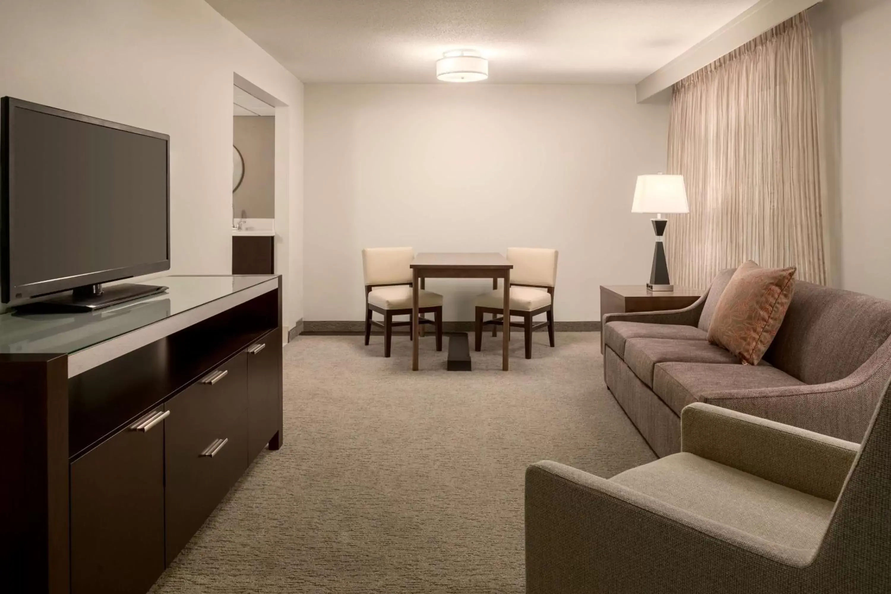 Bedroom, Seating Area in Embassy Suites by Hilton Milwaukee Brookfield