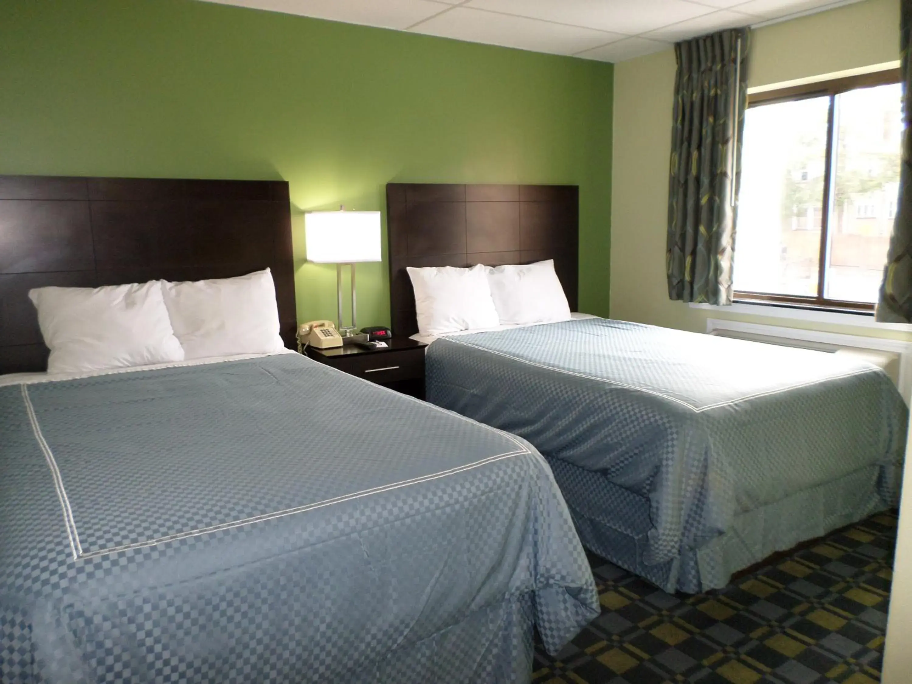 Bed in Travelodge by Wyndham Cleveland Lakewood