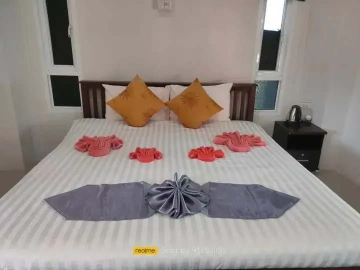 Bed in Tamarind Twin Resort