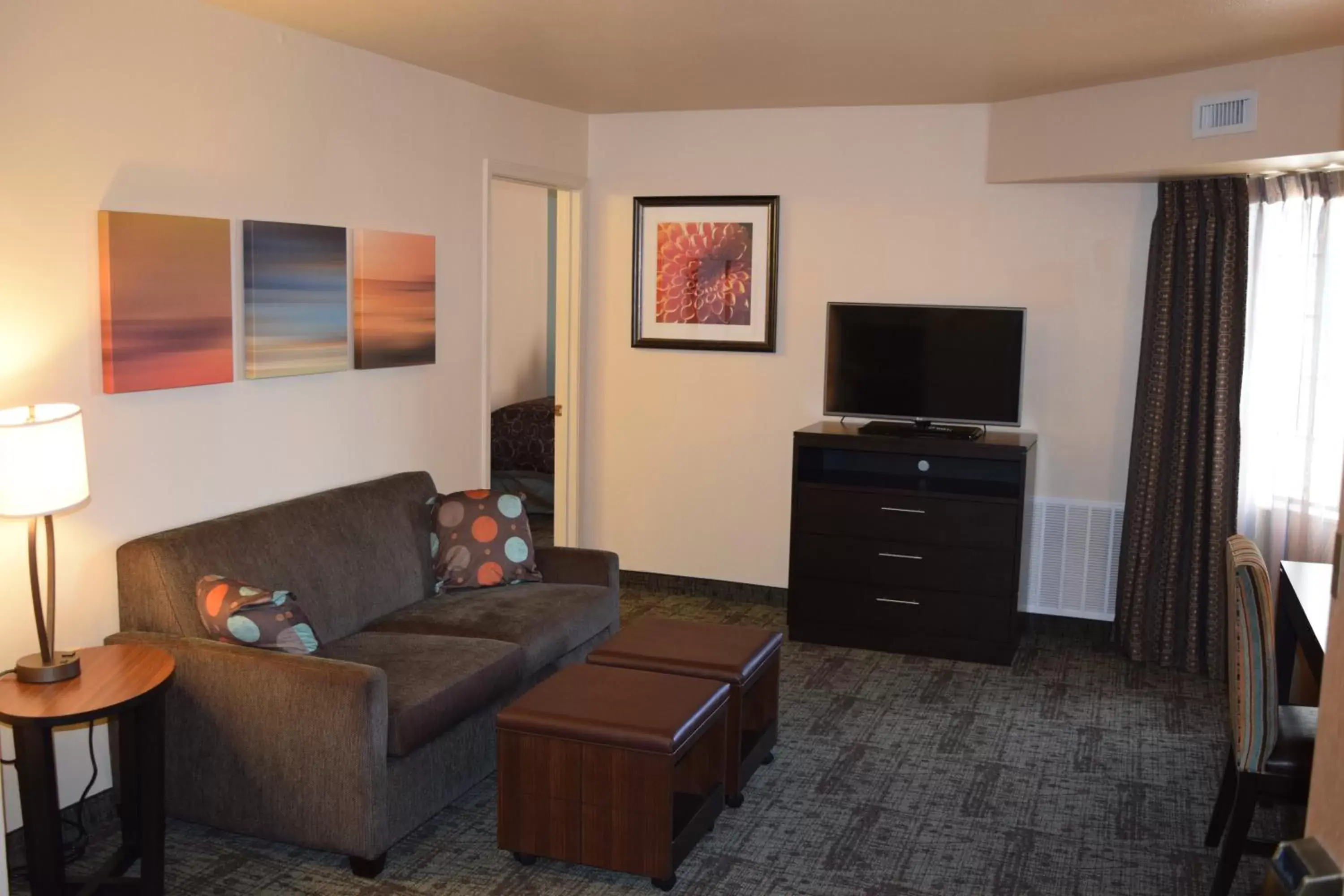 Bedroom, TV/Entertainment Center in Staybridge Suites Myrtle Beach-Fantasy Harbour, an IHG Hotel