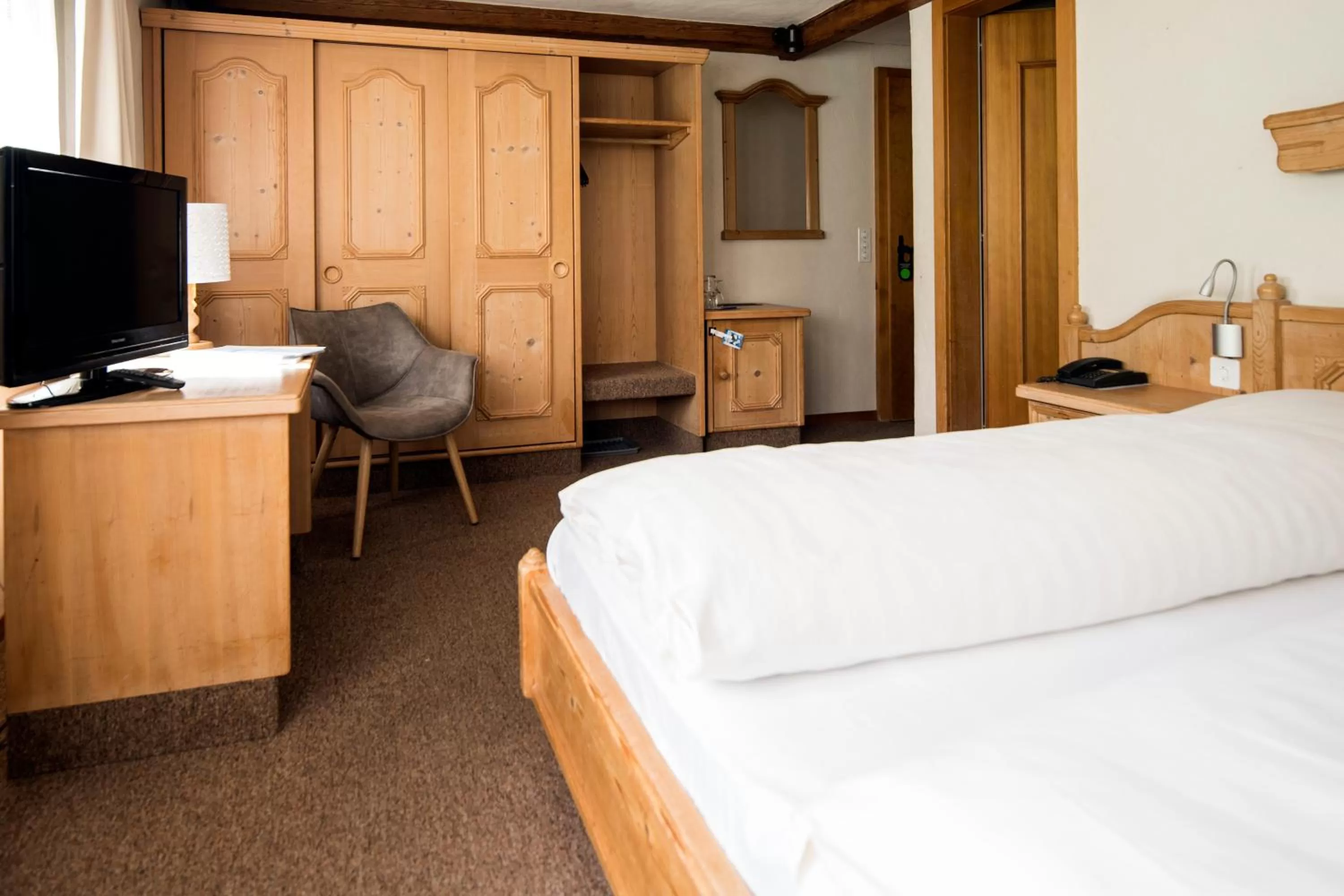 Bed in Hotel Alphorn