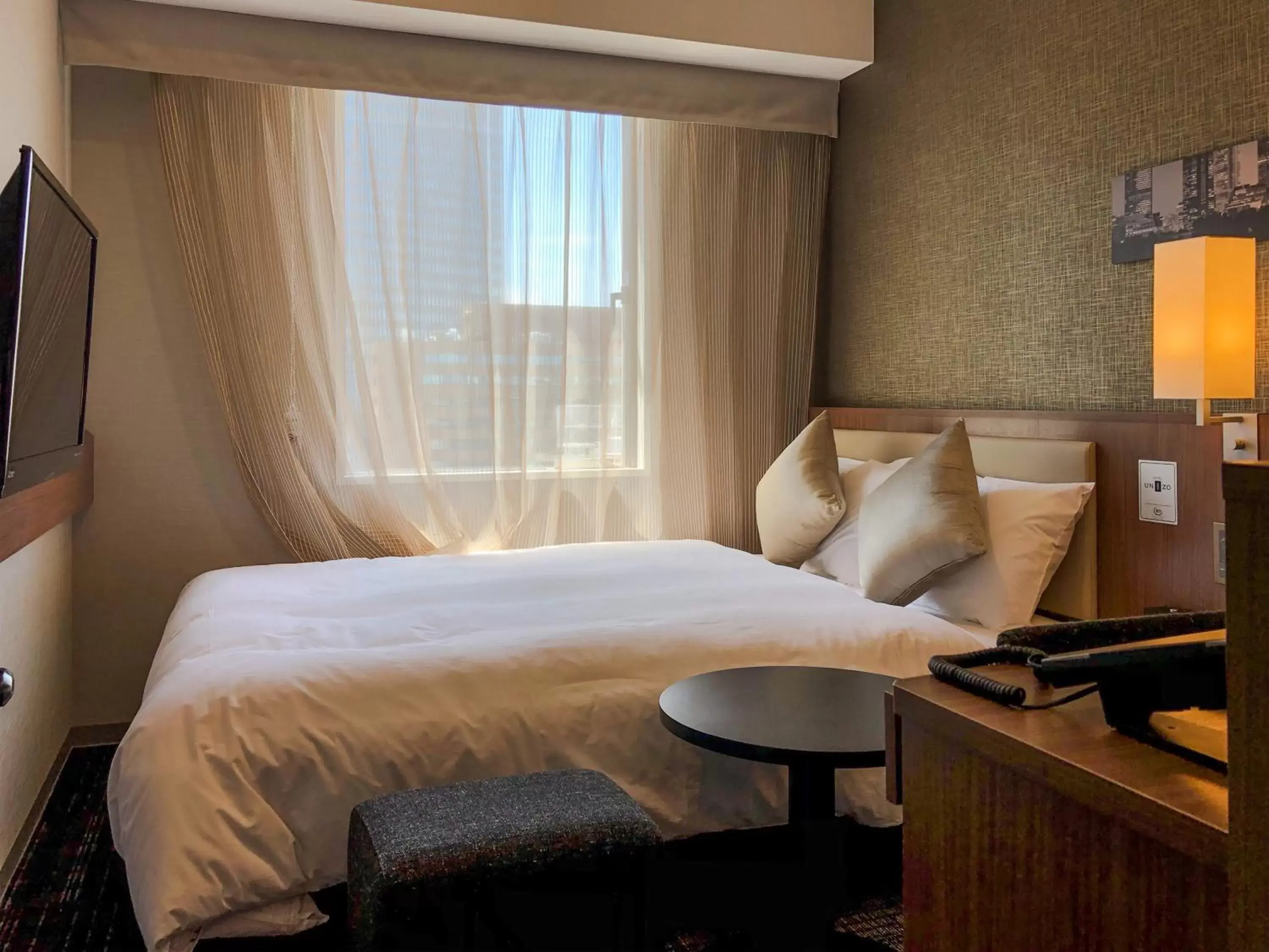 Bed in HOTEL UNIZO Nagoya Ekimae