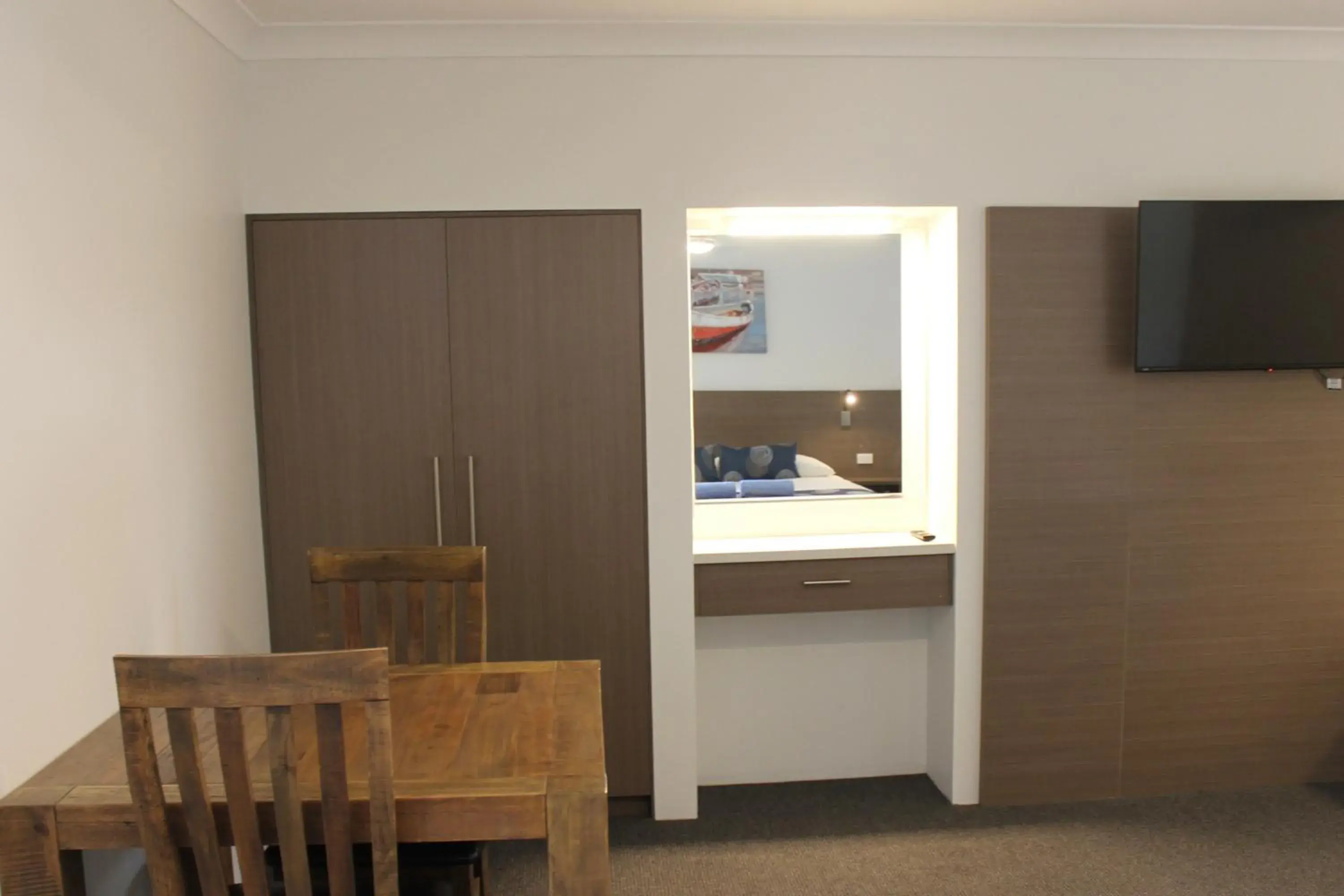 Photo of the whole room, TV/Entertainment Center in Aston Motel Yamba
