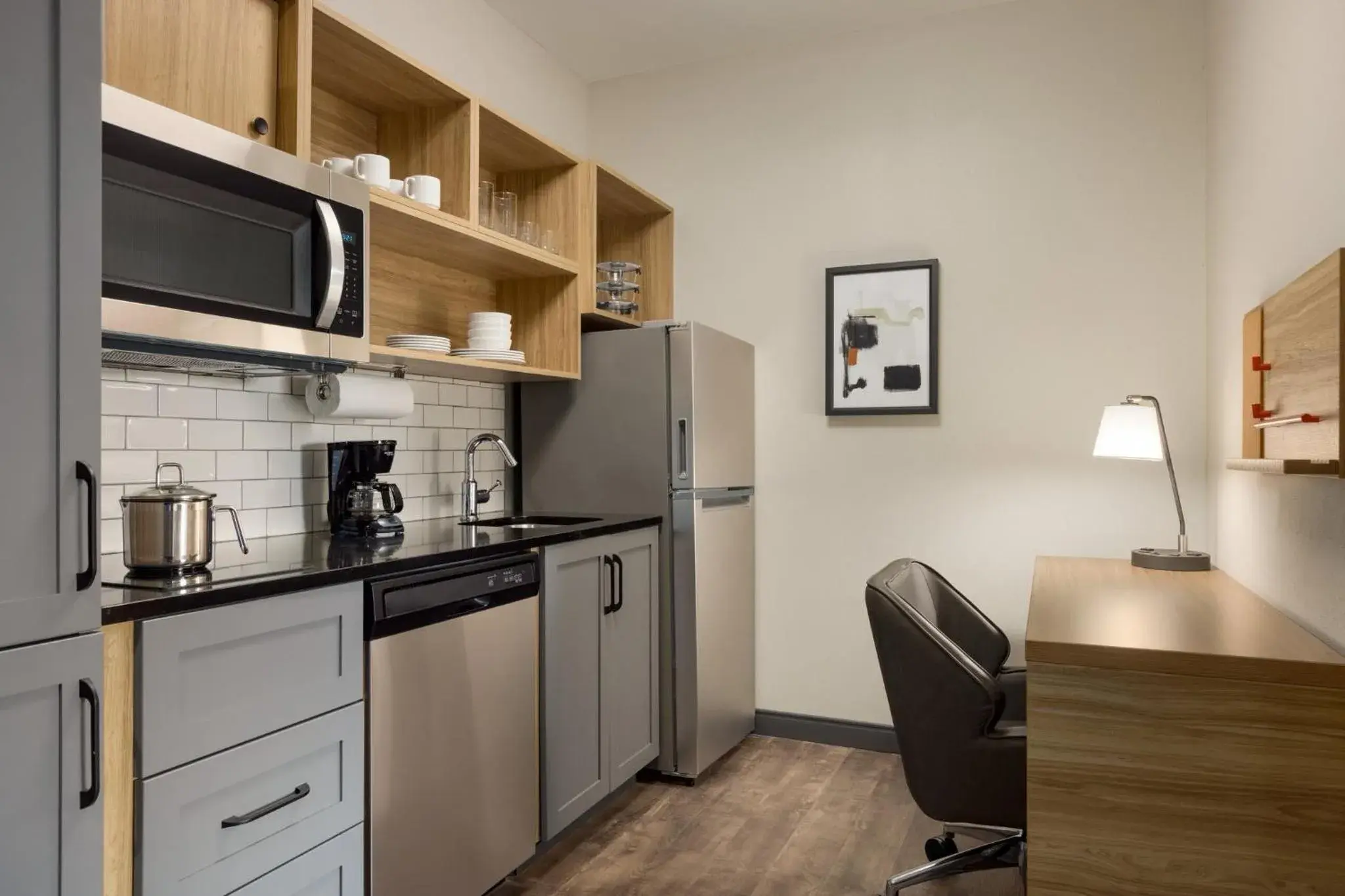 Photo of the whole room, Kitchen/Kitchenette in Candlewood Suites McPherson, an IHG Hotel