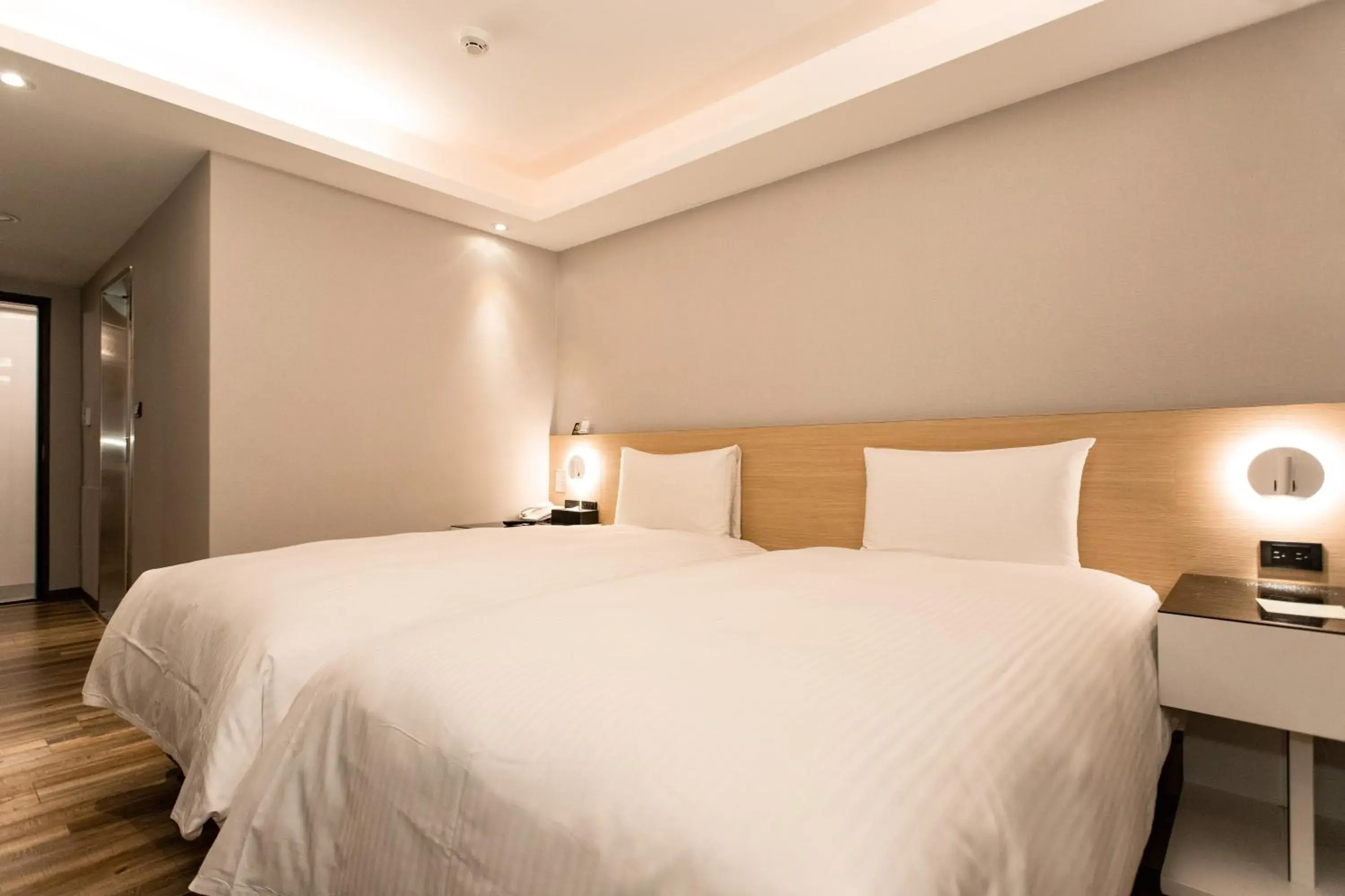 Bed in Hub Hotel Tucheng