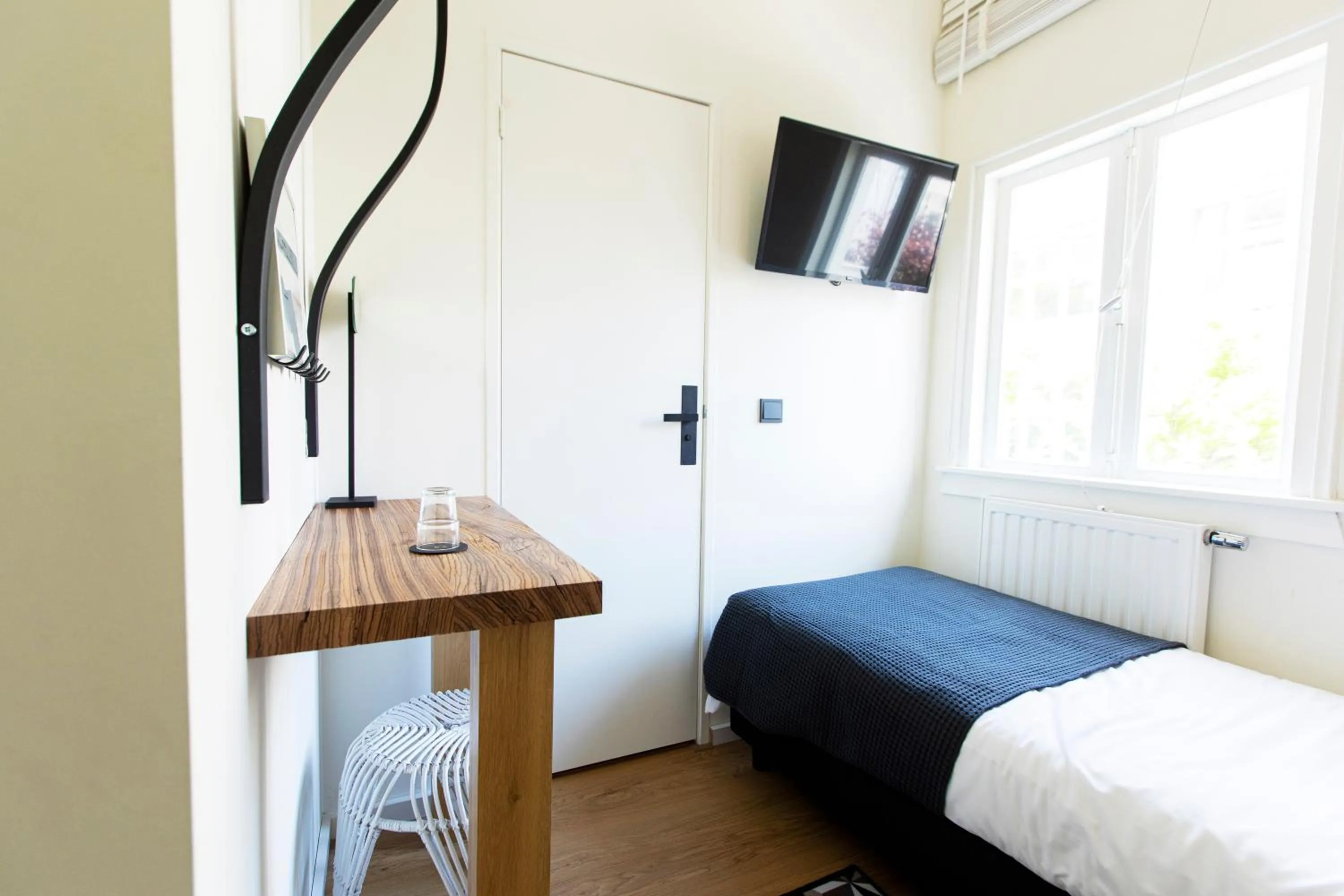 Bed in Quentin Golden Bear Hotel