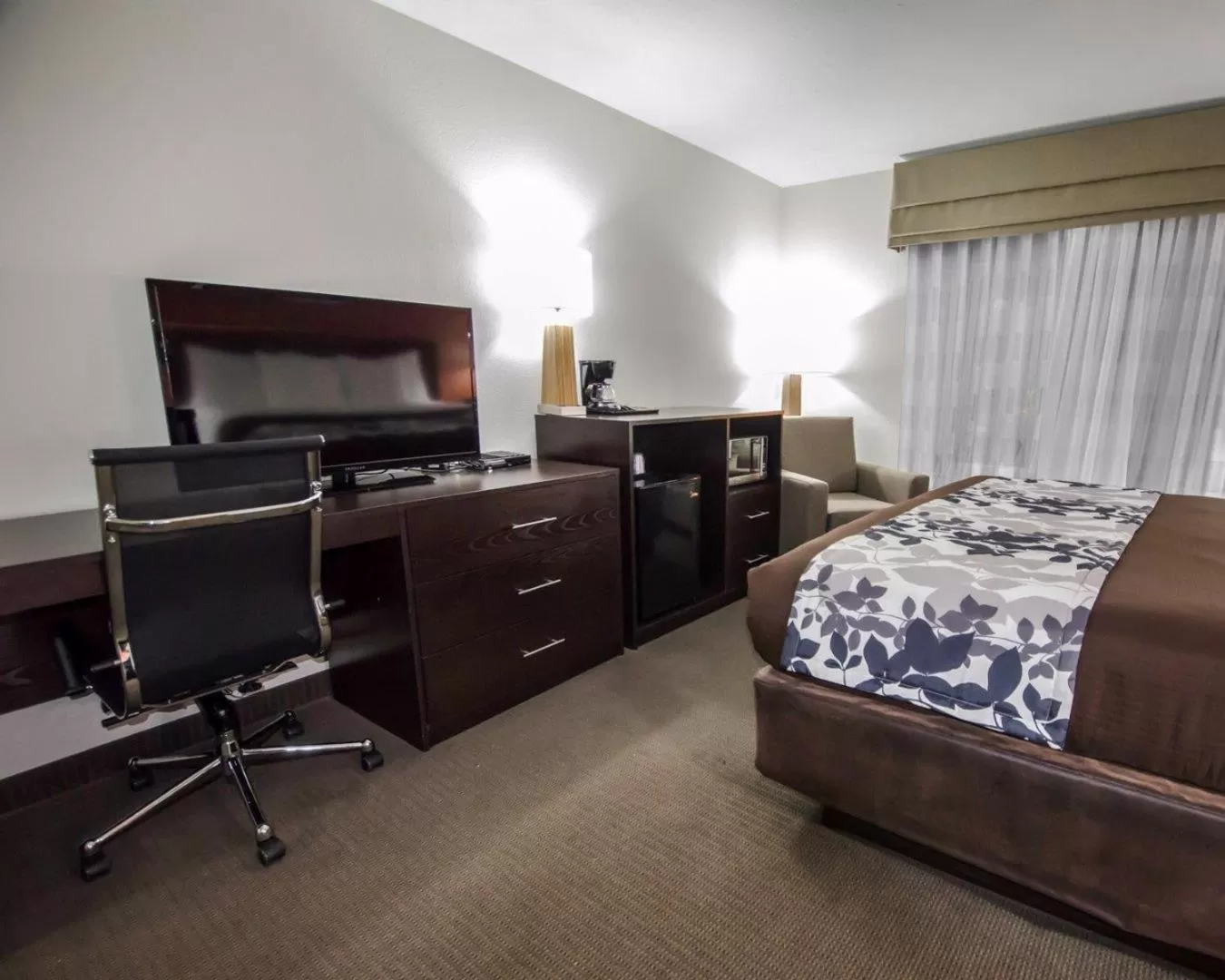 Photo of the whole room, Bed in Sleep Inn & Suites And Conference Center Downtown