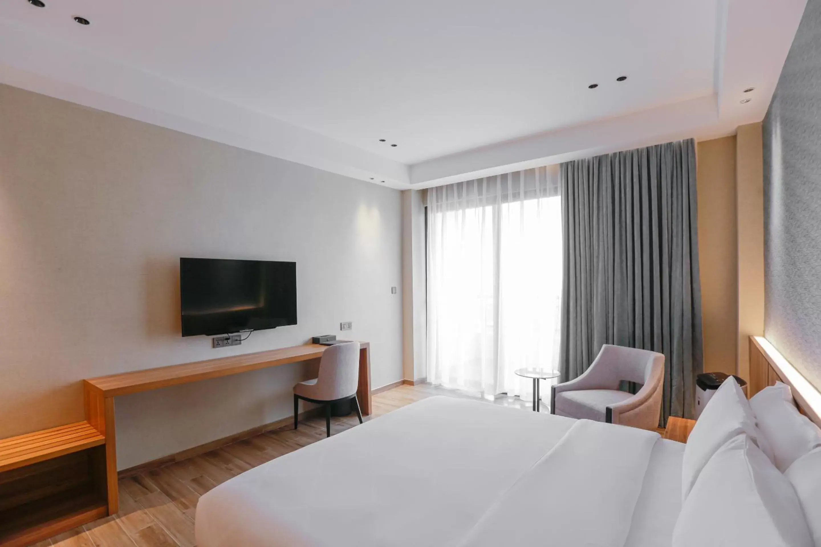 Bedroom, TV/Entertainment Center in Hotel Casiana Managed by Enderun Hotels