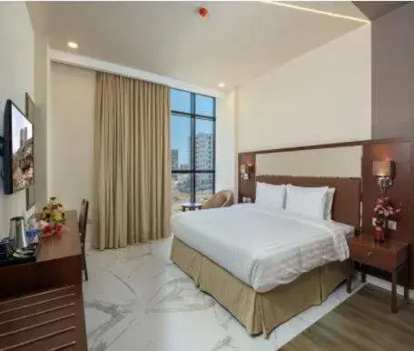 Photo of the whole room, Bed in Muscat Gate Hotel Photo of the whole room, Bed in Muscat Gate Hotel