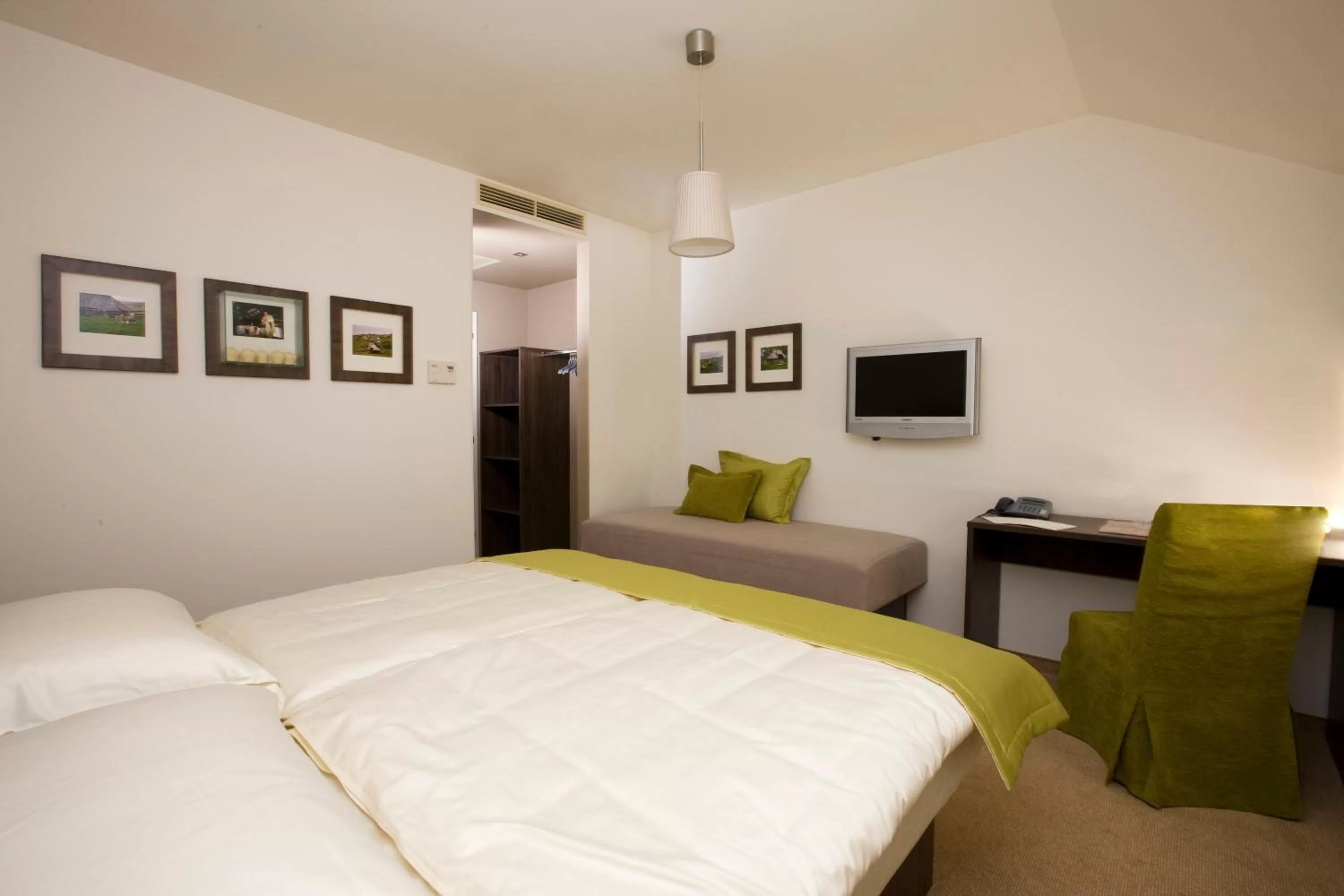 Bed in Ambient Hotel