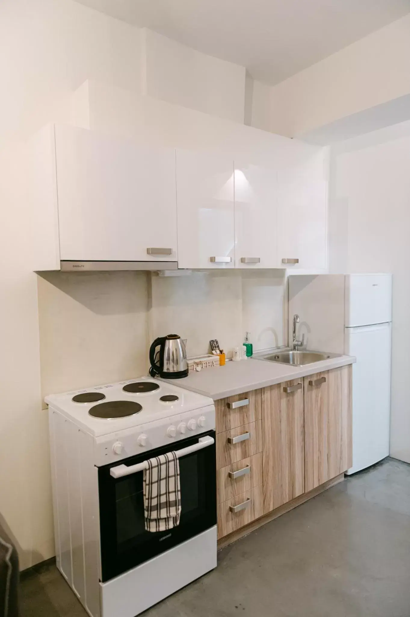 Kitchen/Kitchenette in MAGNOLIA SUITES