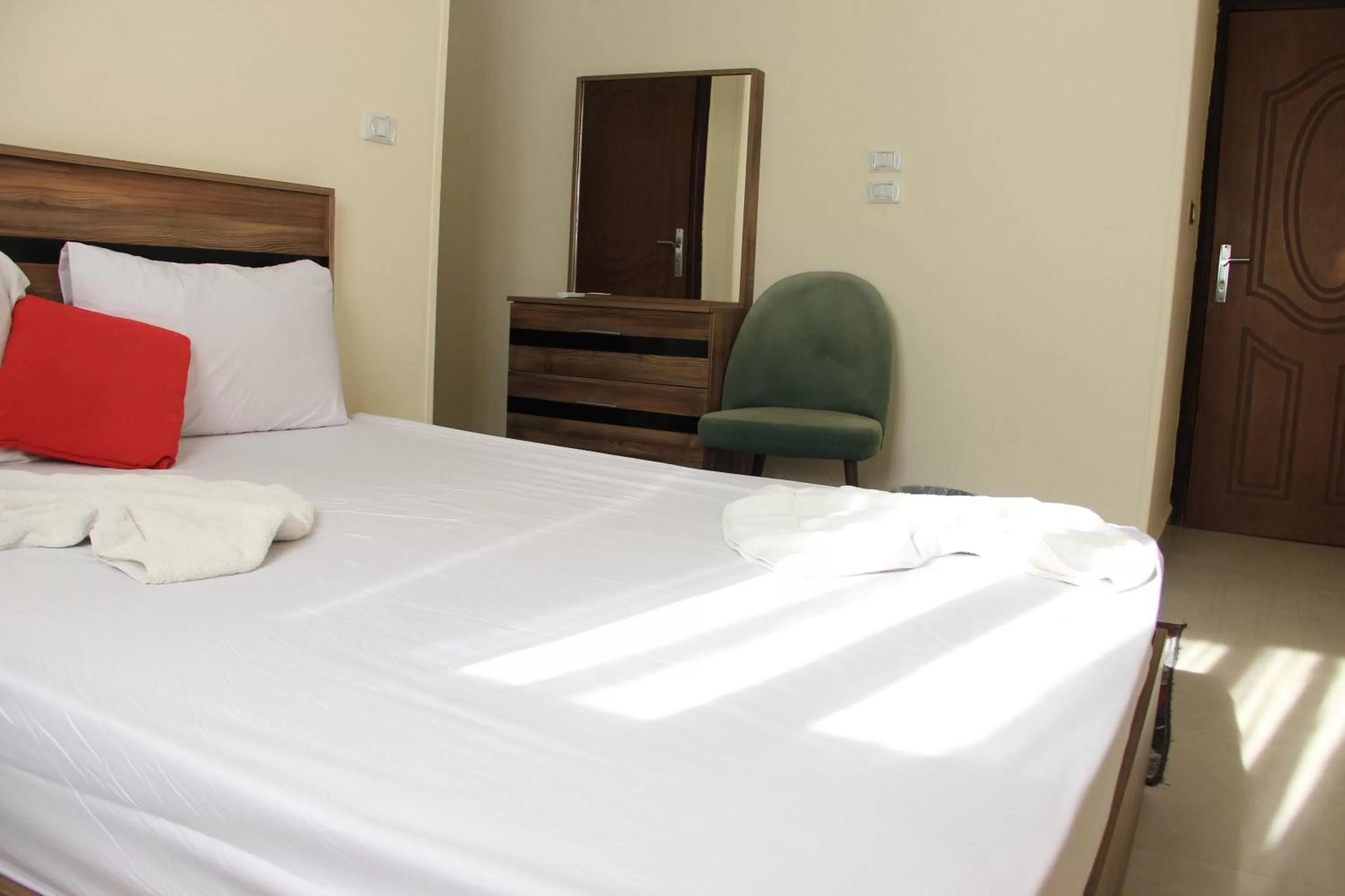 Bed in Gardenia Inn Hotel