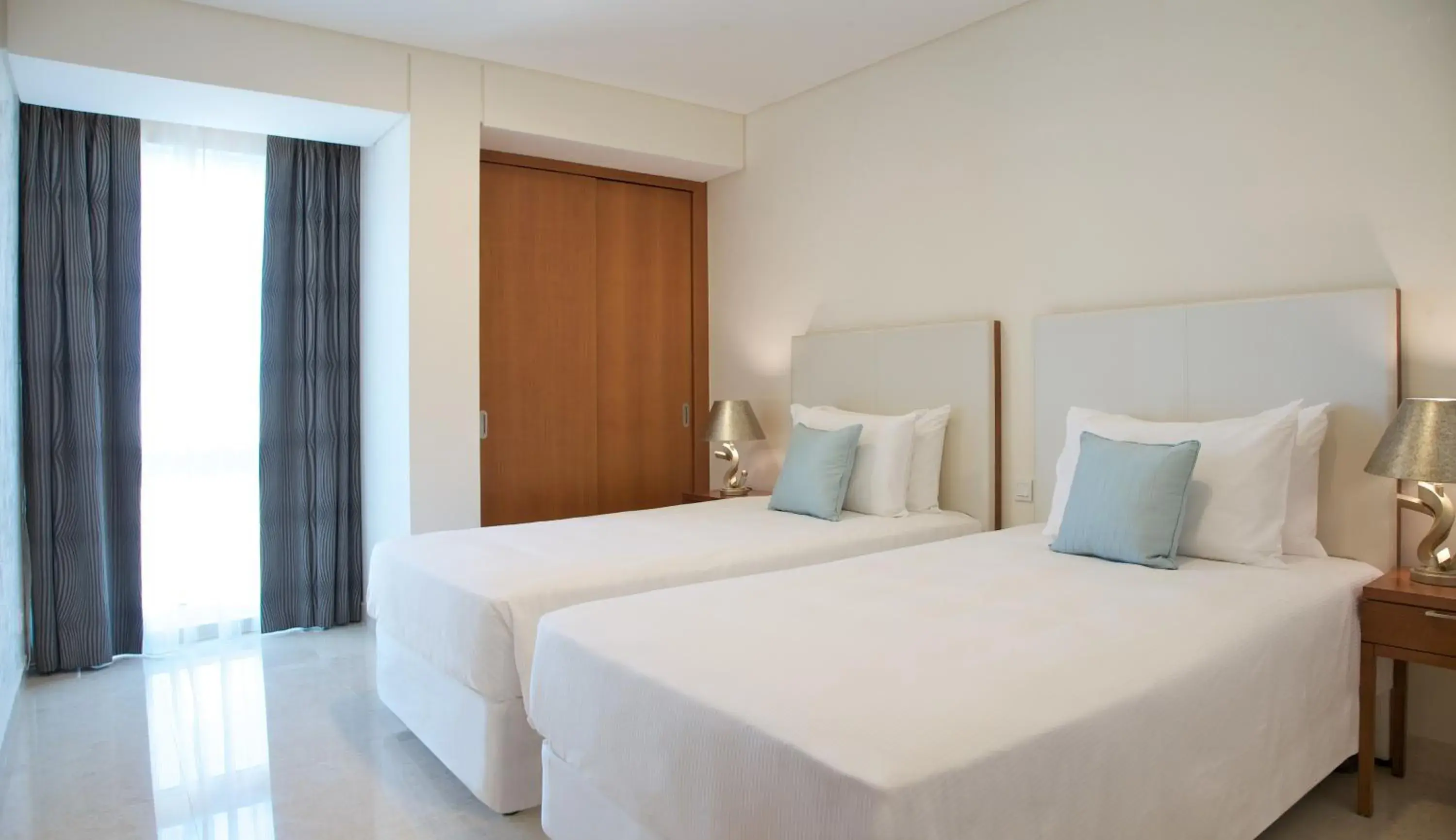 Bedroom, Bed in Millennium Executive Apartments Muscat