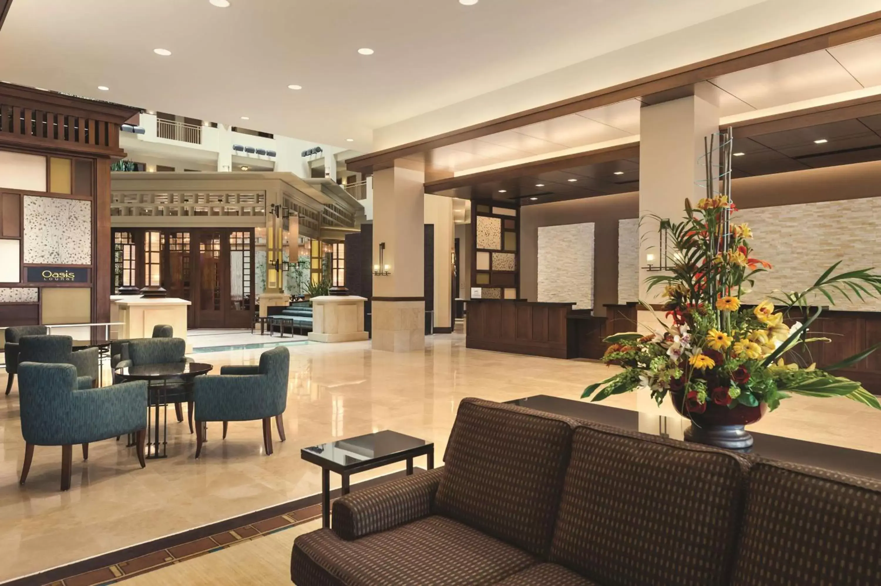 Lobby or reception in Embassy Suites by Hilton Orlando Lake Buena Vista South Lobby or reception in Embassy Suites by Hilton Orlando Lake Buena Vista South