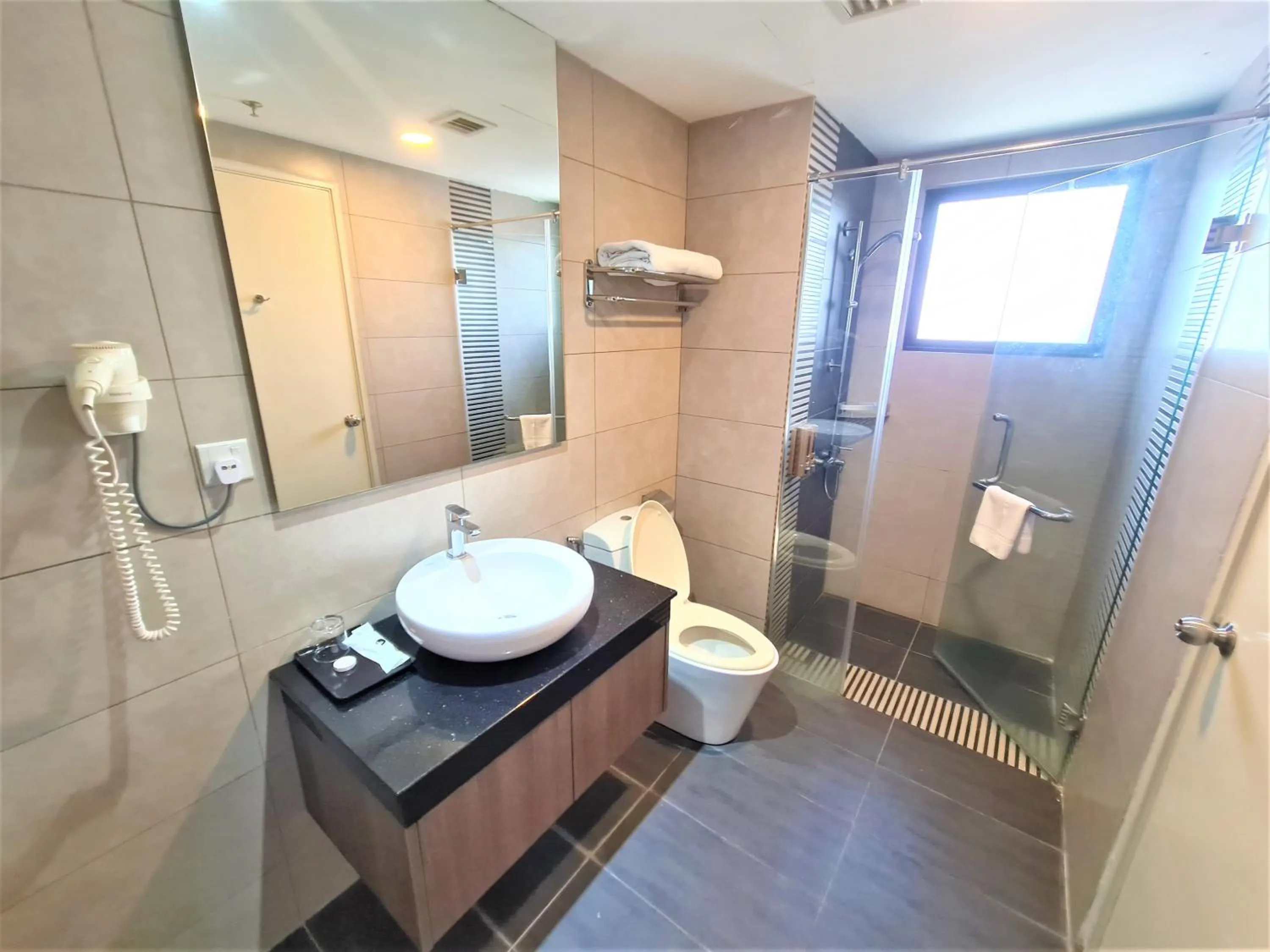 Shower in Nexus Regency Suites & Hotel