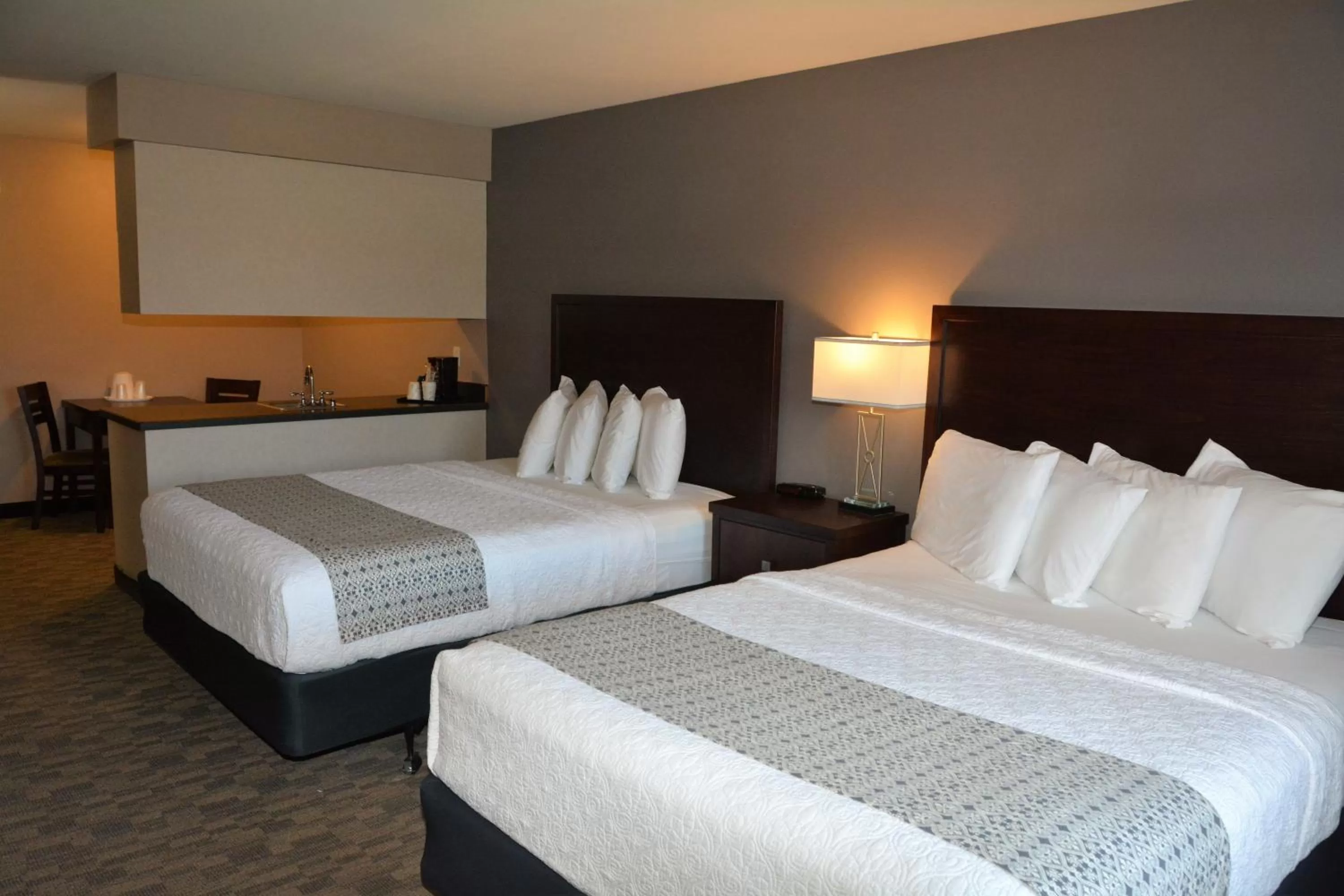Bed in FairBridge Inn & Suites DuPont