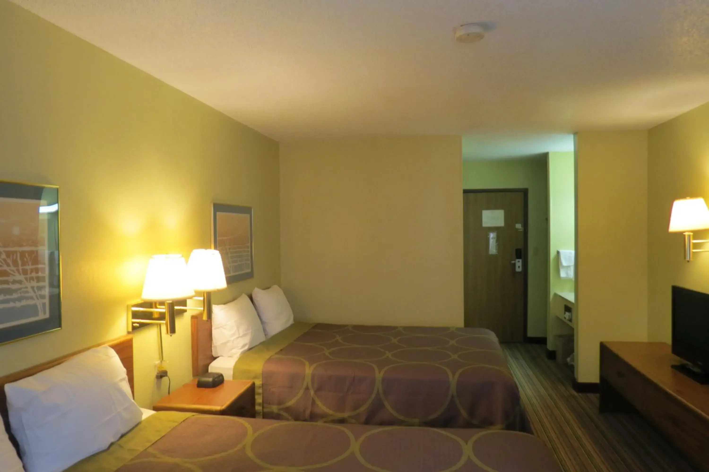 Bed in Super 8 by Wyndham Evansville East