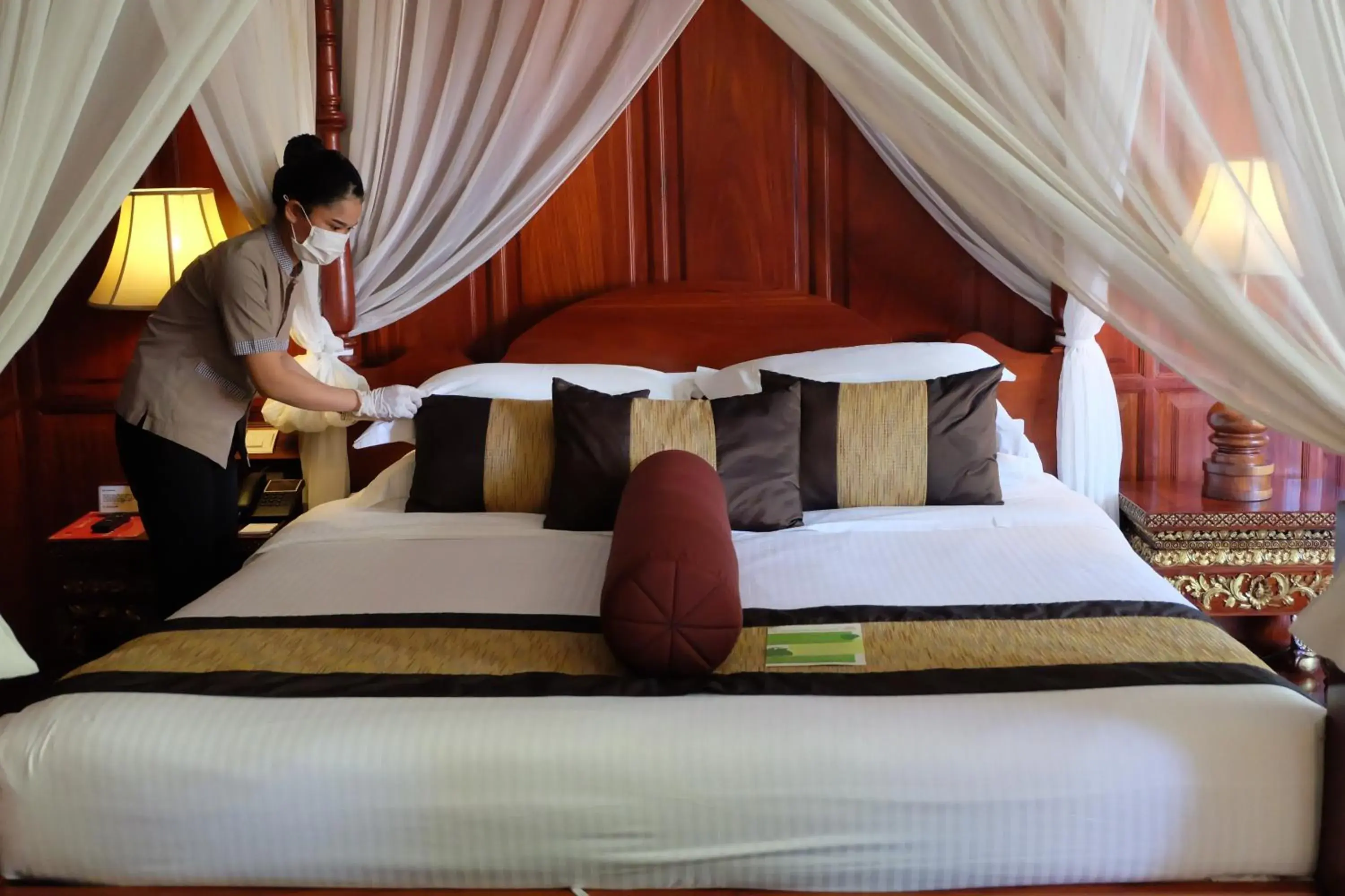 Bed in Empress Angkor Resort & Spa