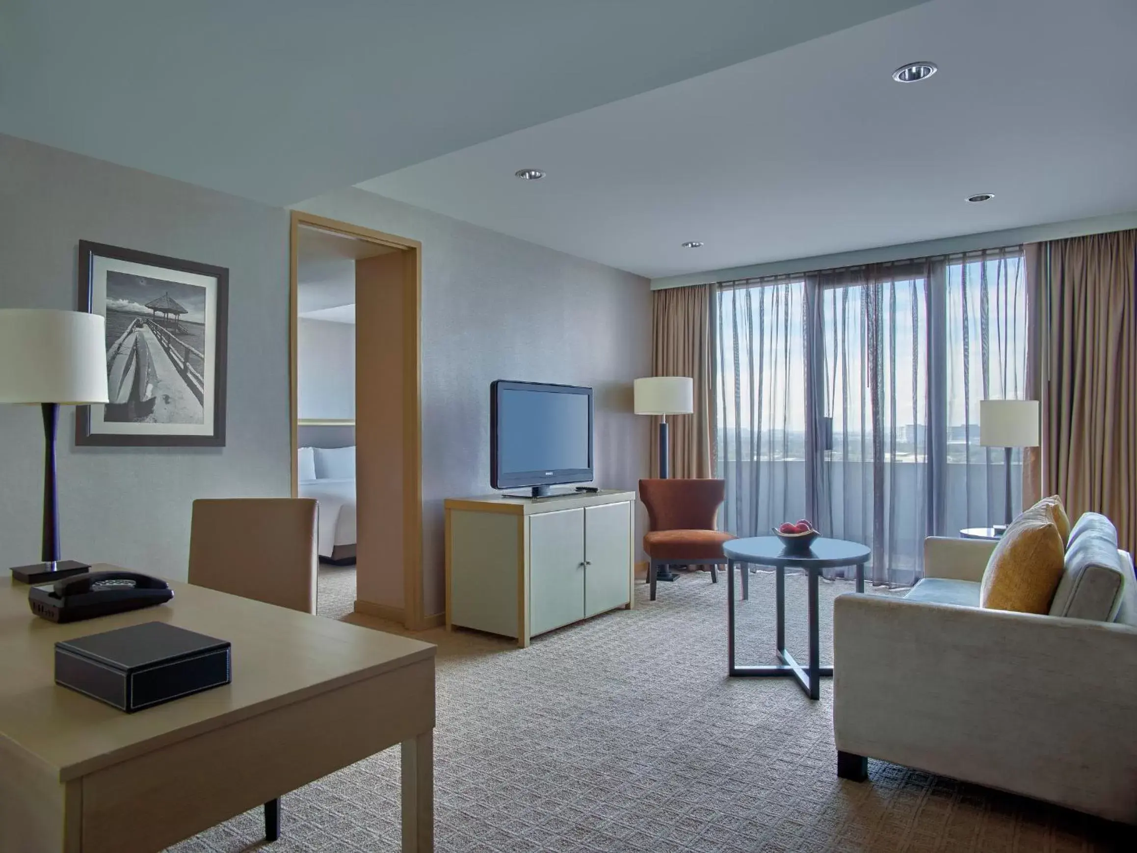 Living room, TV/Entertainment Center in New World Makati Hotel, Manila