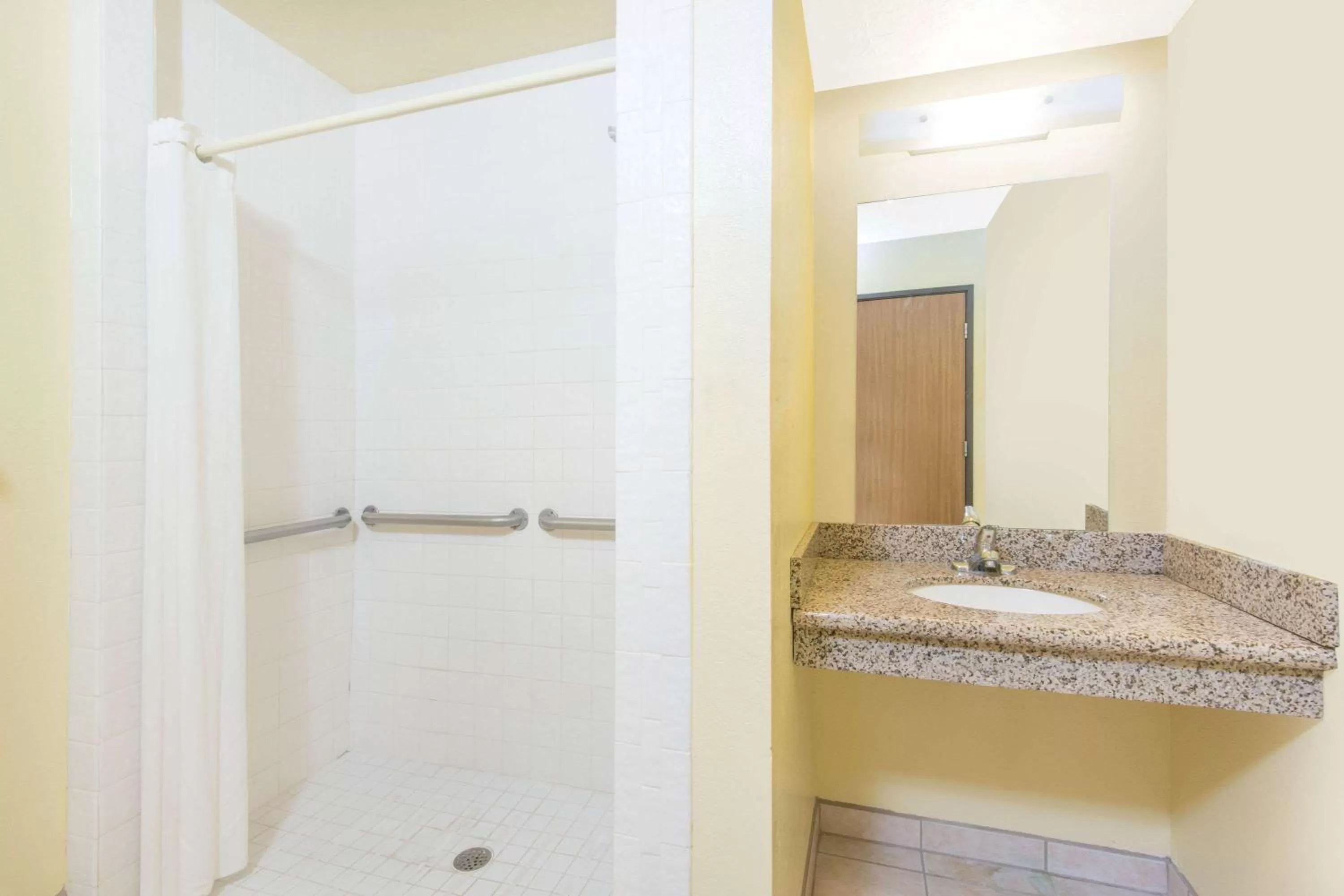 Shower in Super 8 by Wyndham Moriarty