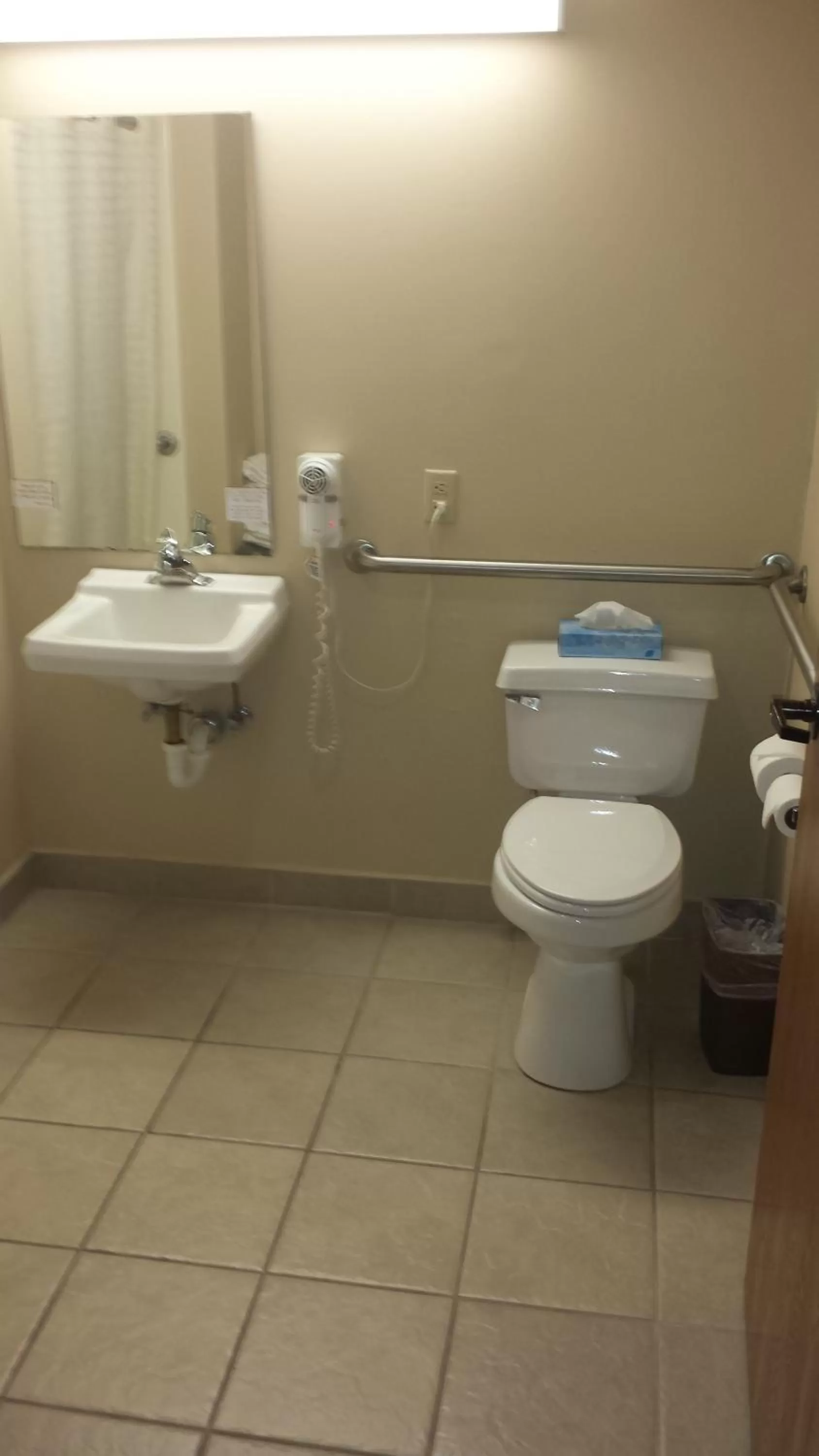 Toilet in All American Inn & Suites Branson
