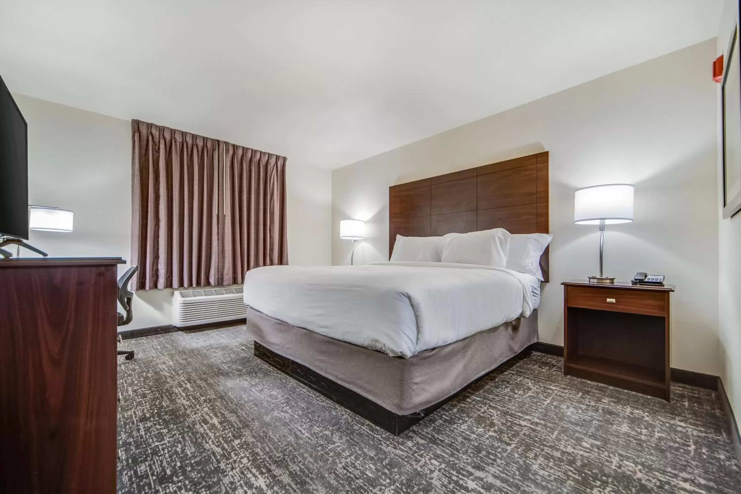 Bed in Cobblestone Hotel & Suites - Cozad