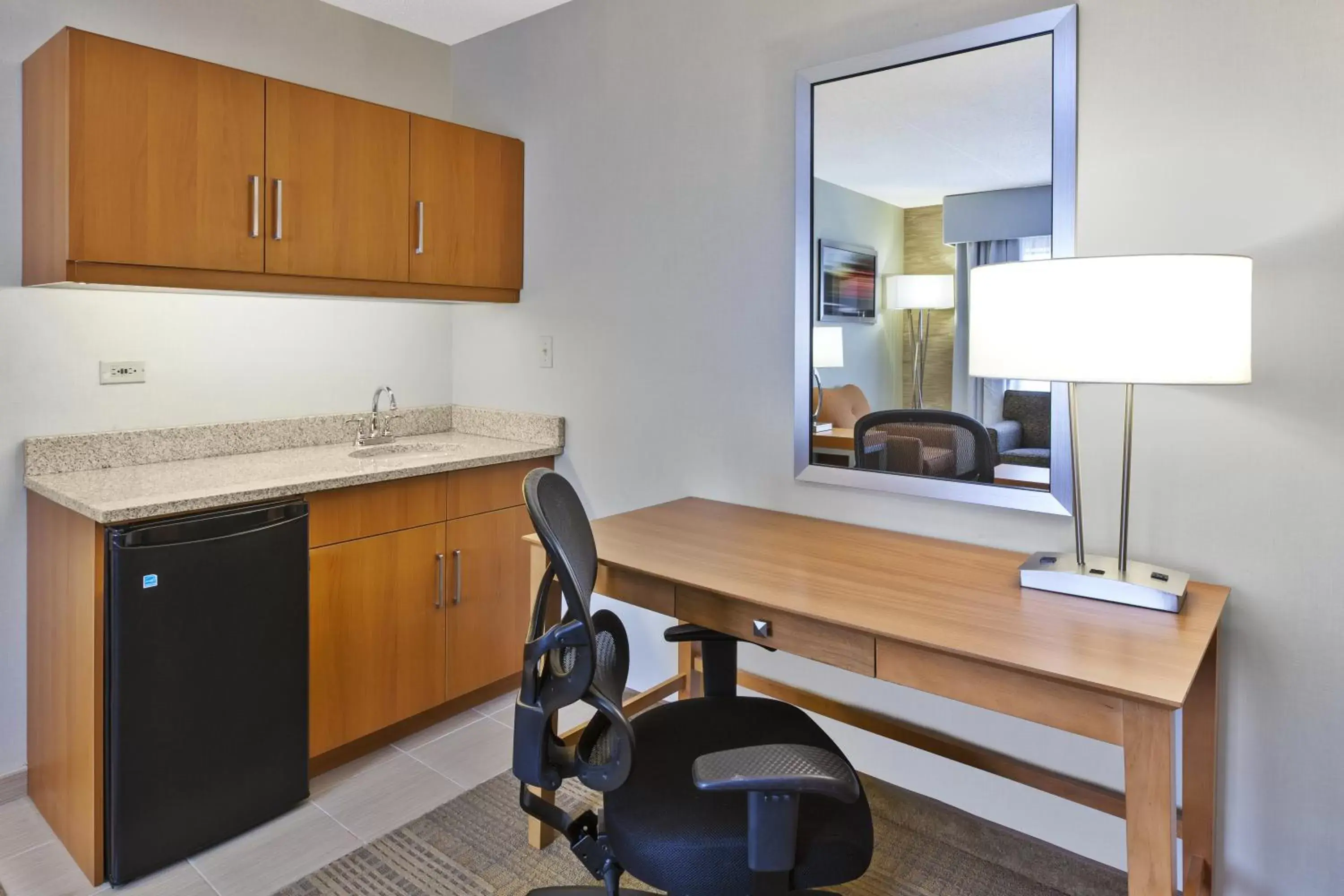 Bedroom, Kitchen/Kitchenette in Holiday Inn Hotel & Suites Bolingbrook, an IHG Hotel