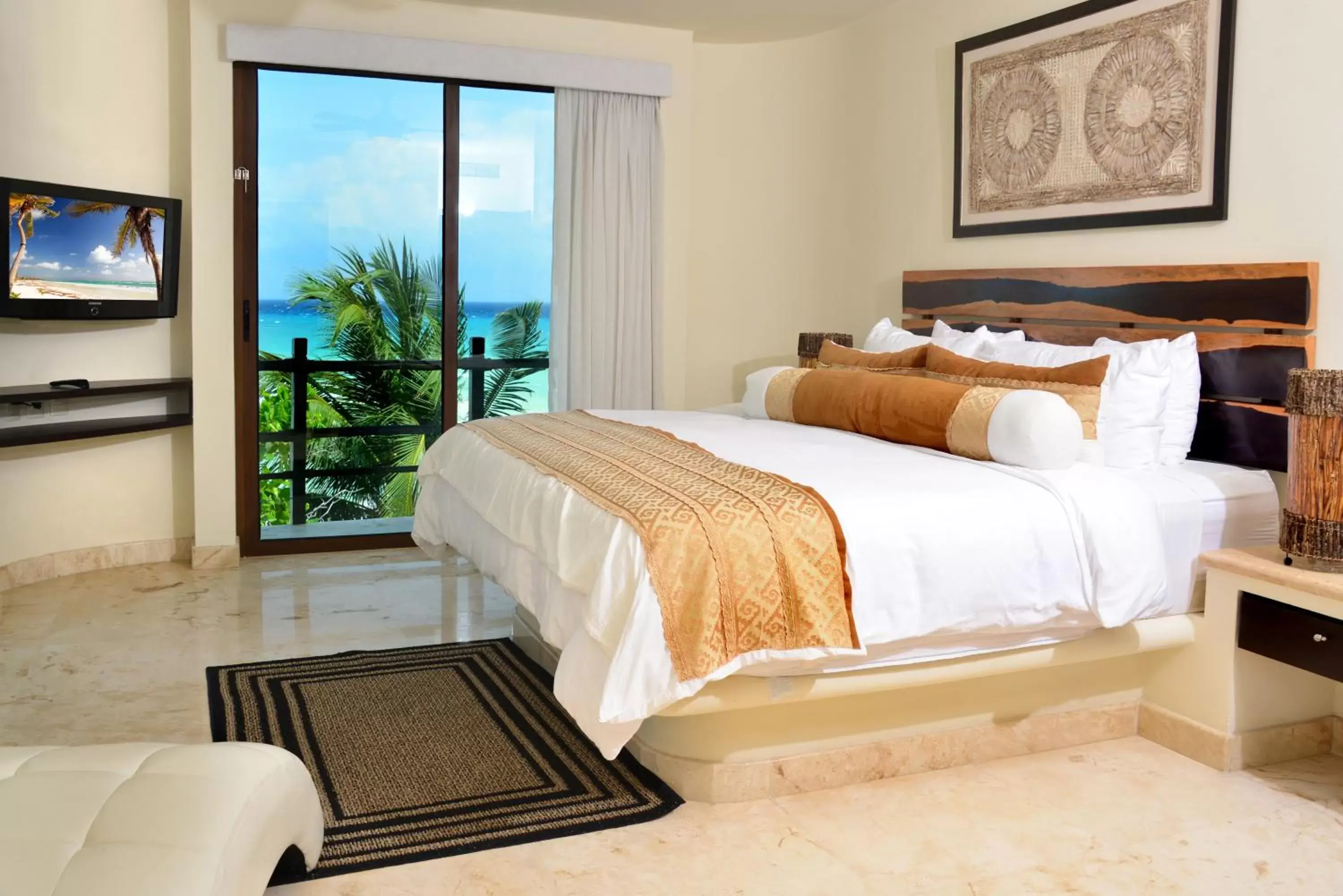 Bed in El Taj Oceanfront and Beachside Condo Hotel